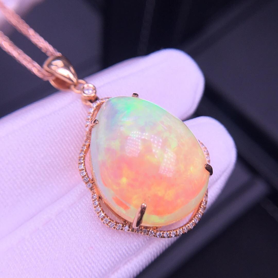 

18K Rose Gold Huge Gem Genuine Opal Pendant with Diamonds Ruby Sapphire/Raw Stone Boulder Fire Opal Necklace is a wow factor at 15.8ct Australian opal.  This shows off bright colors blue yellow pink green and colors can all be different so we have