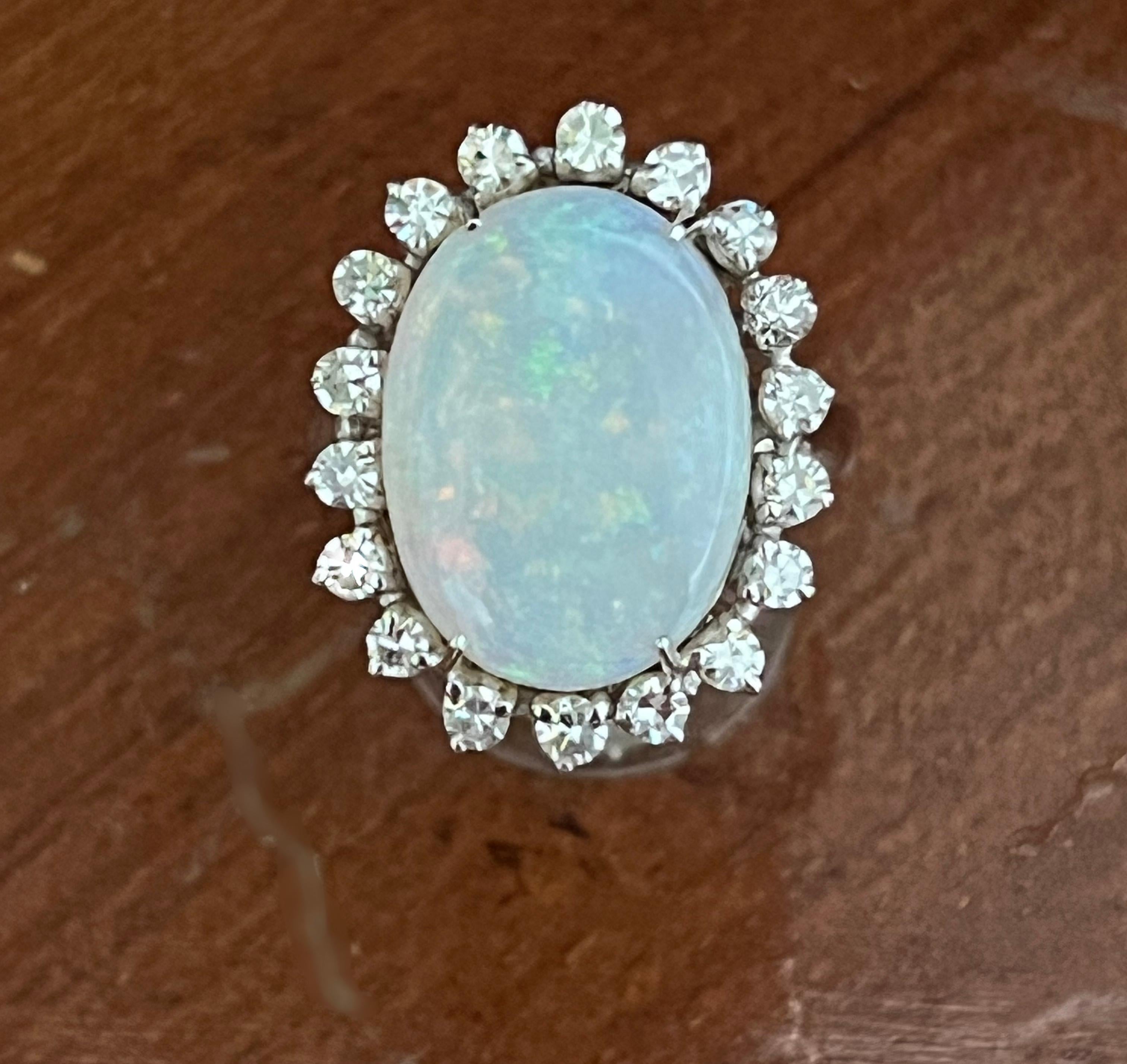 Amazing 18 Karat white gold cocktail ring. Handmade by our craftsmen and assembled with Australian opal and diamonds.

Diamonds weight 0.80 karat
Opal weight 6.96 karat
Ring total weight 8.40 grams
Ring size ITA 16.50 - US 7.75
(all rings are can be