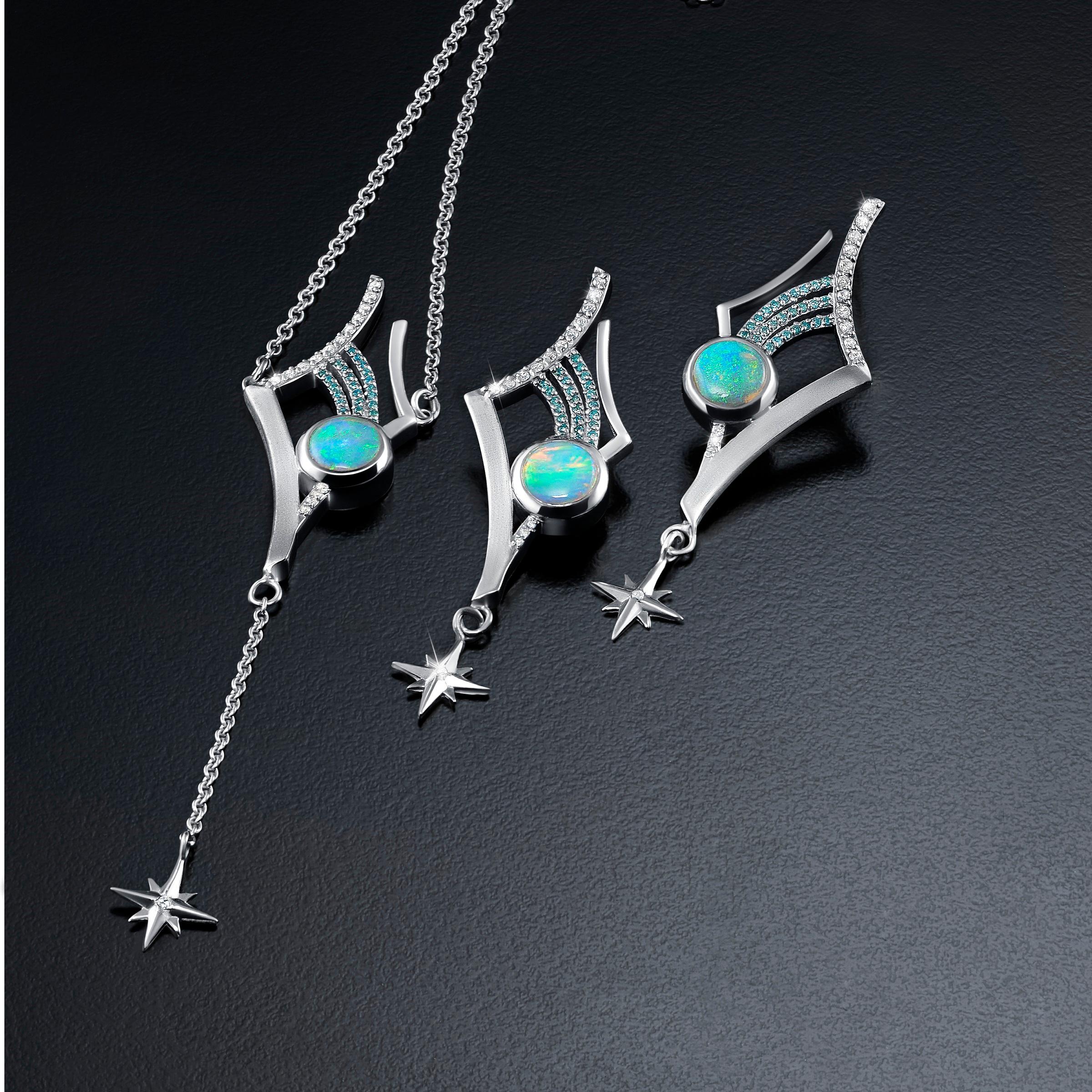 The Antares Earrings are exquisitely fashioned from sterling silver, featuring intricate detailing in both polished and satin finishes that capture the light and mirror the twinkle of distant stars. Each earring measures 2 inches in length and
