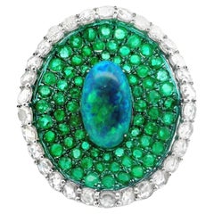 Anello cocktail con smeraldo e diamante australiano in oro e rodio verde 18k