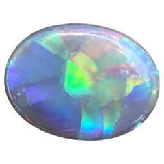 Opale australiano ovale cabochon 6,53 carati, pietra opalescente luminosa, modello a bandiera