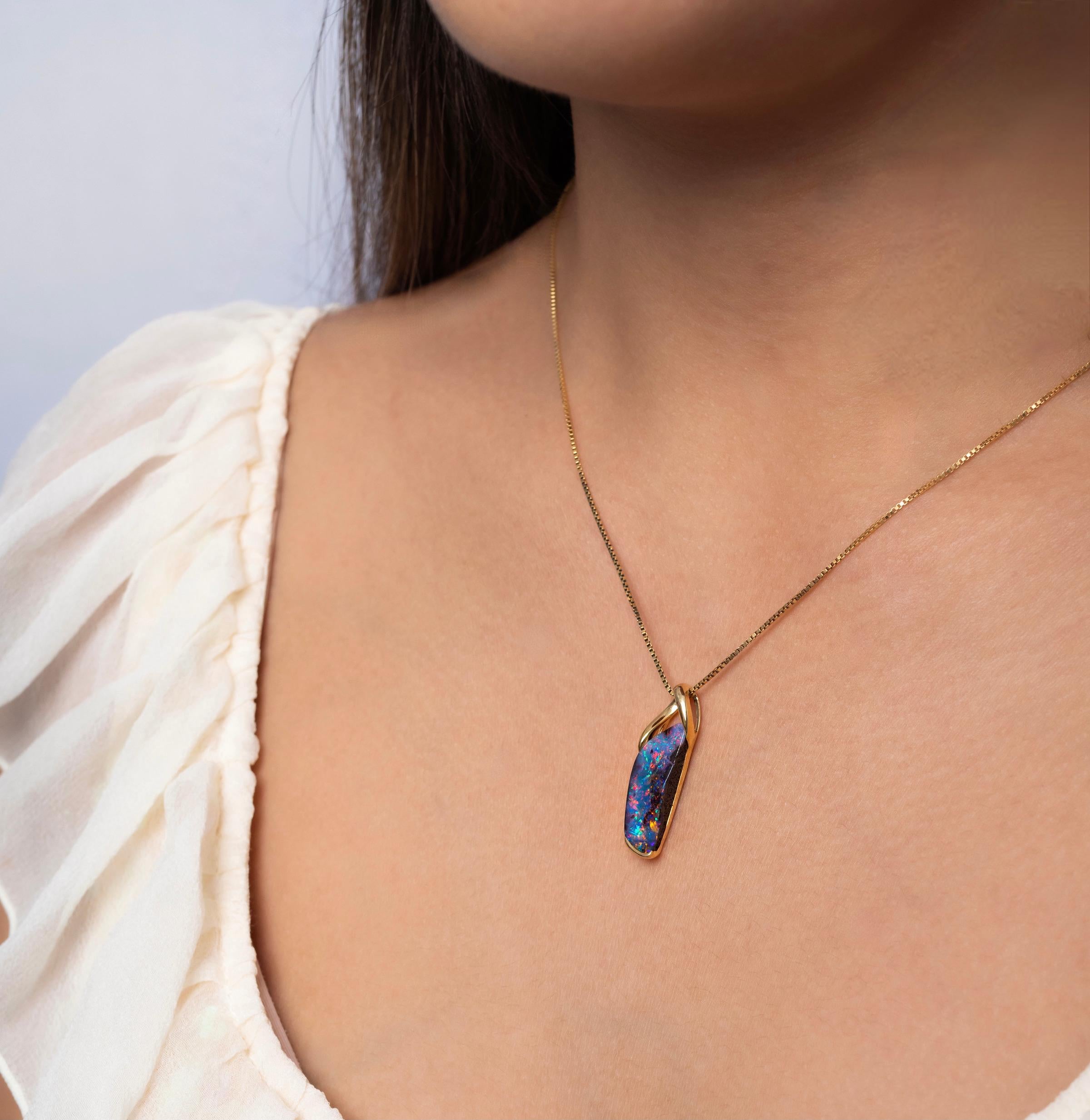 “Splendid Moment” opal pendant shows off a rare and spectacular multicoloured Australian opal (11.73ct) in a simple 18K rose gold setting. This versatile piece is designed to accommodate thicker omega and snake chains. Handcrafted to perfection,
