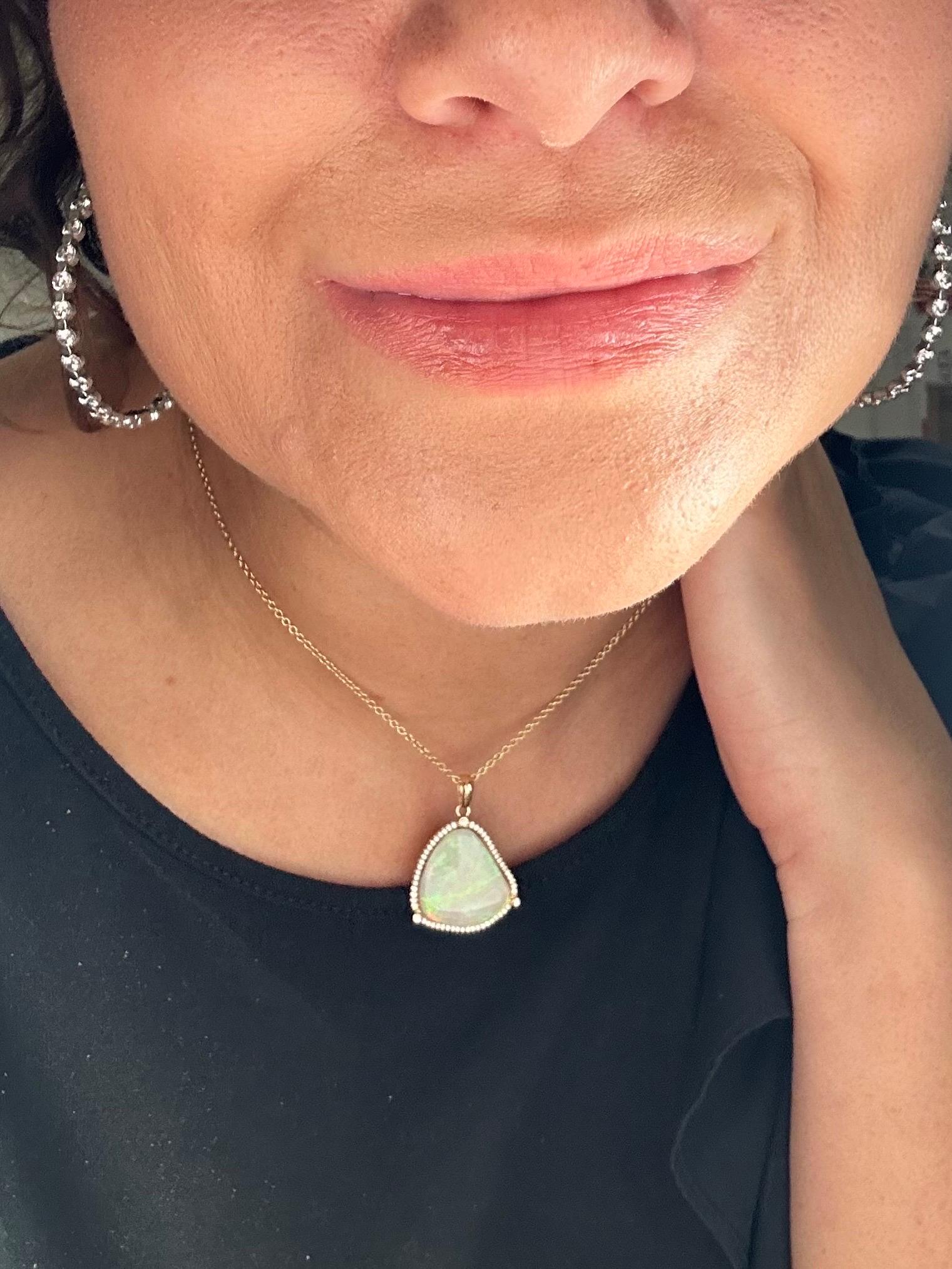 Australian opal pendant necklace with micro diamond setting in 14KT yellow gold. The pendant is made with excellent craftsmanship and fantastic design, classical with modern twist. Stunning sparkle on the opal and a fancy ball chain.

GOLD: 14KT