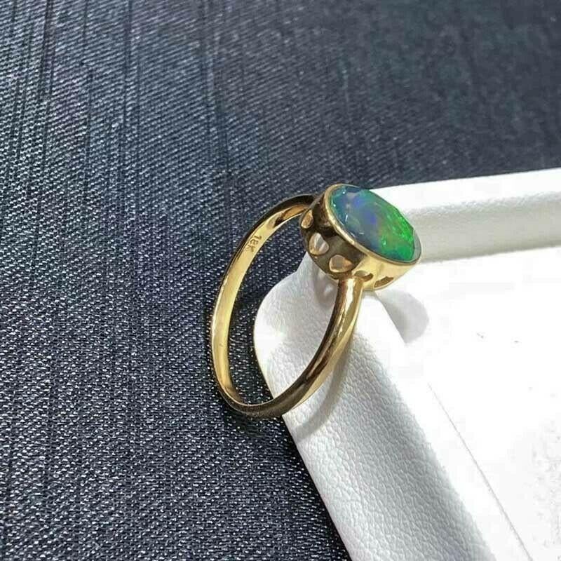 


Australian Opal Ring shows off bright colors Blue Green Yellow  and set in 18k Yellow Gold.  From Coober Pedy South Australia.  It does stand out in this opal cut,  

Let us know your size if not listed 


