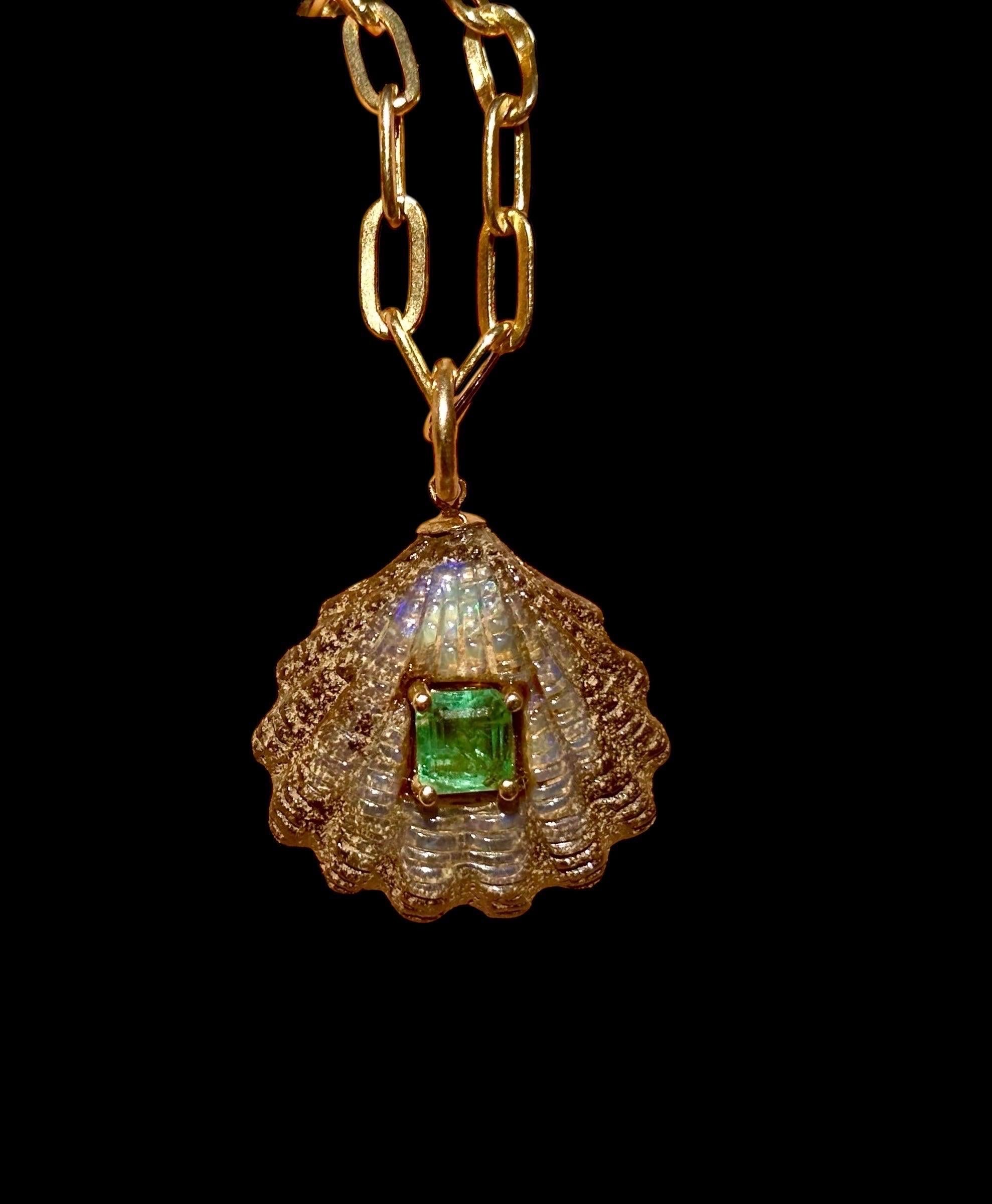 Australian Opal Shell Pendant

Australian Opal, Emerald, 14k Gold

Carved Australian Opal, 25mm diameter with center 6x5mm emerald. 

The thick gold ring bail can accommodate a chain, cord and beaded necklace up to 5mm in width. 

This opal was