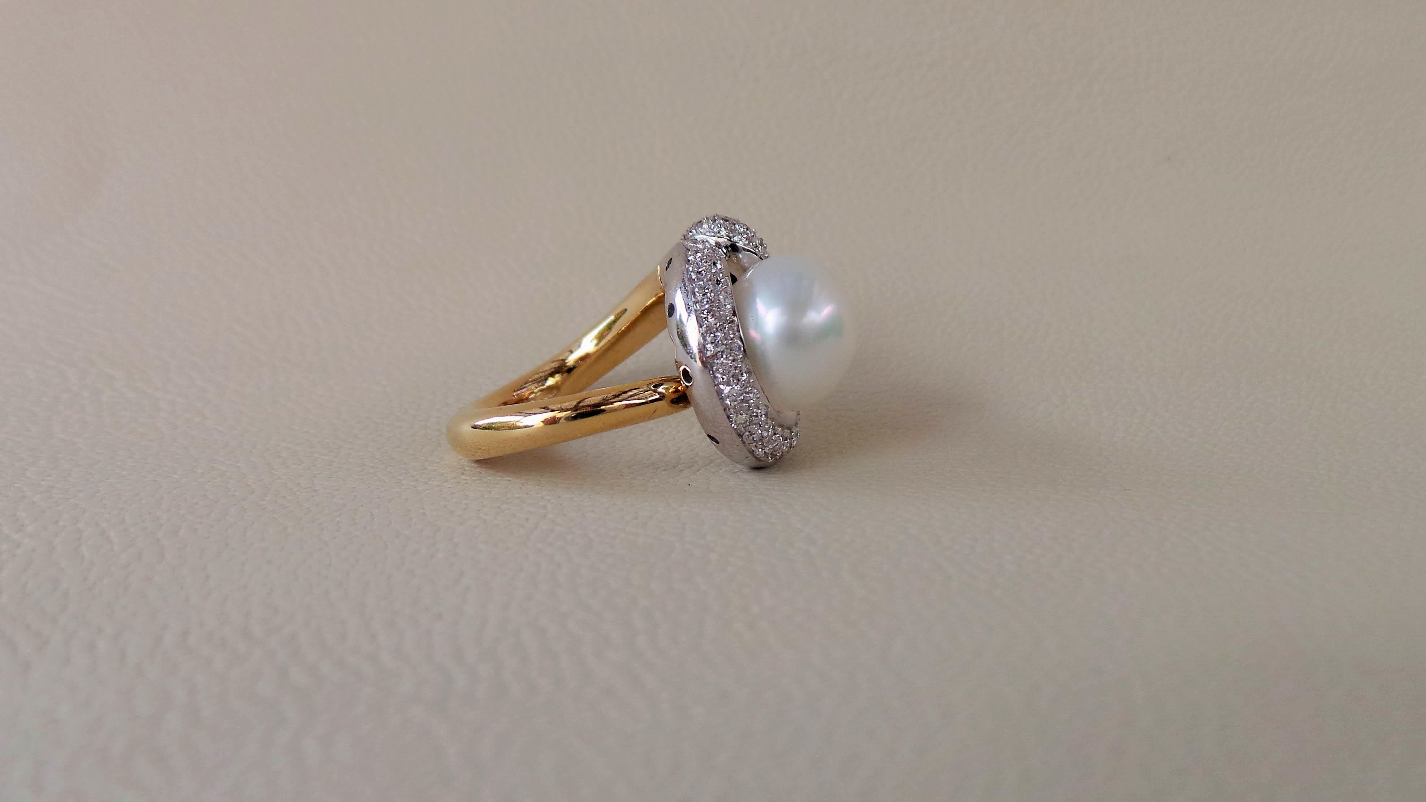 Andrea Macinai design a dedicated collection for cocktail rings  with a perl and diamonds.
A 12 mm Australian pearl is surrounded by round diamonds white cut brilliant in yellow and white gold cocktail ring. 
The ring was designed and made following