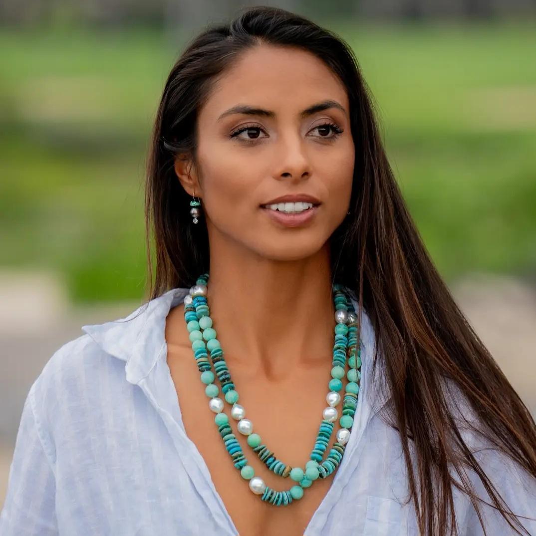 An oceanic mix dances throughout this special handmade Helix Necklace of Pearls, Turquoise, and Amazonite. 

14 South Sea Australian Pearls ranging from 13 mm to 14mm in size, Natural Multi-color Turquoise discs, and Natural Amazonite rounds. All