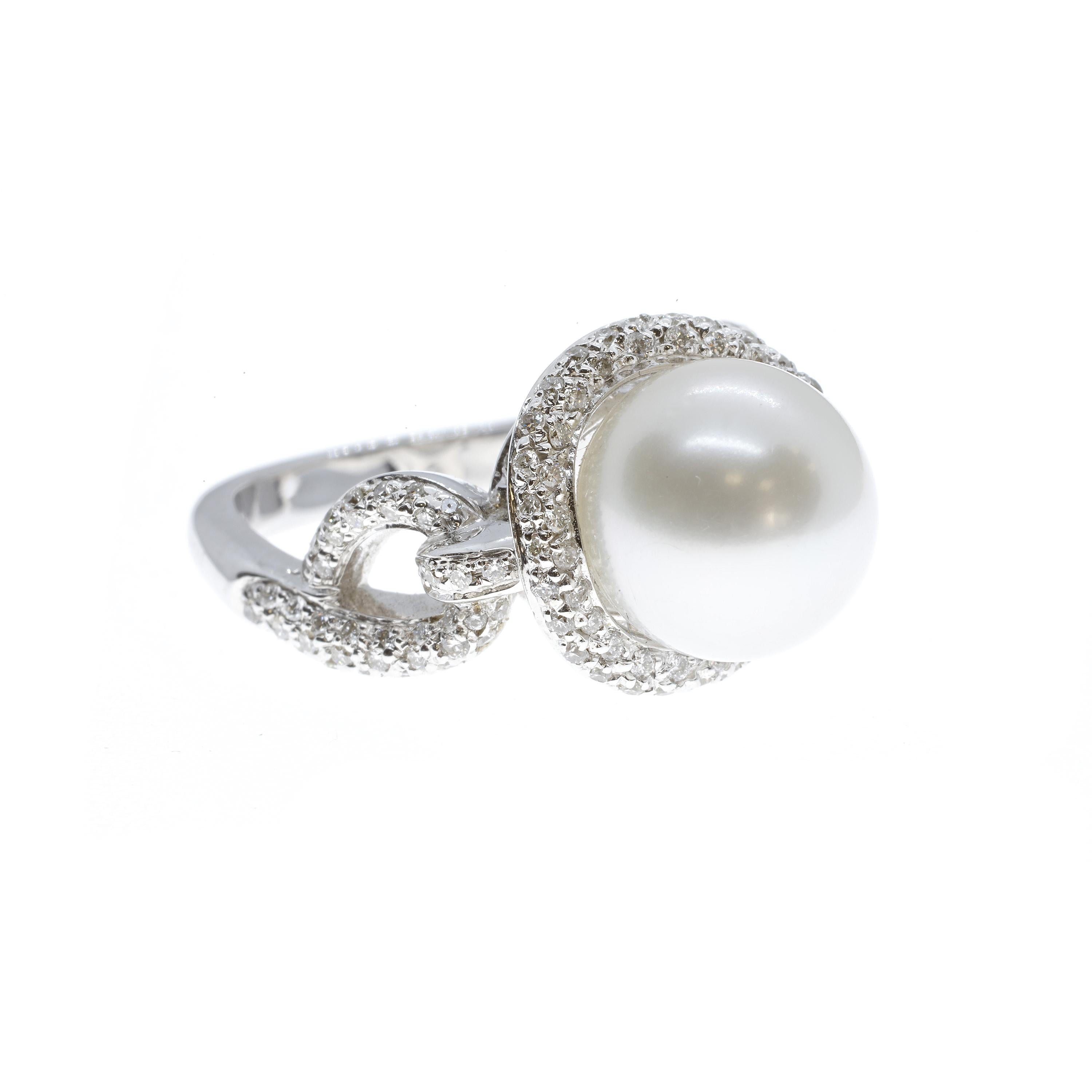 A stunning cocktail ring that is glamorous both on and off the hand. Created from 18-karat white gold, this ring features a large 11-carat Australian pearl. The luminous pearl is framed  by a looping link design of 0.65-carats of pavé-set white