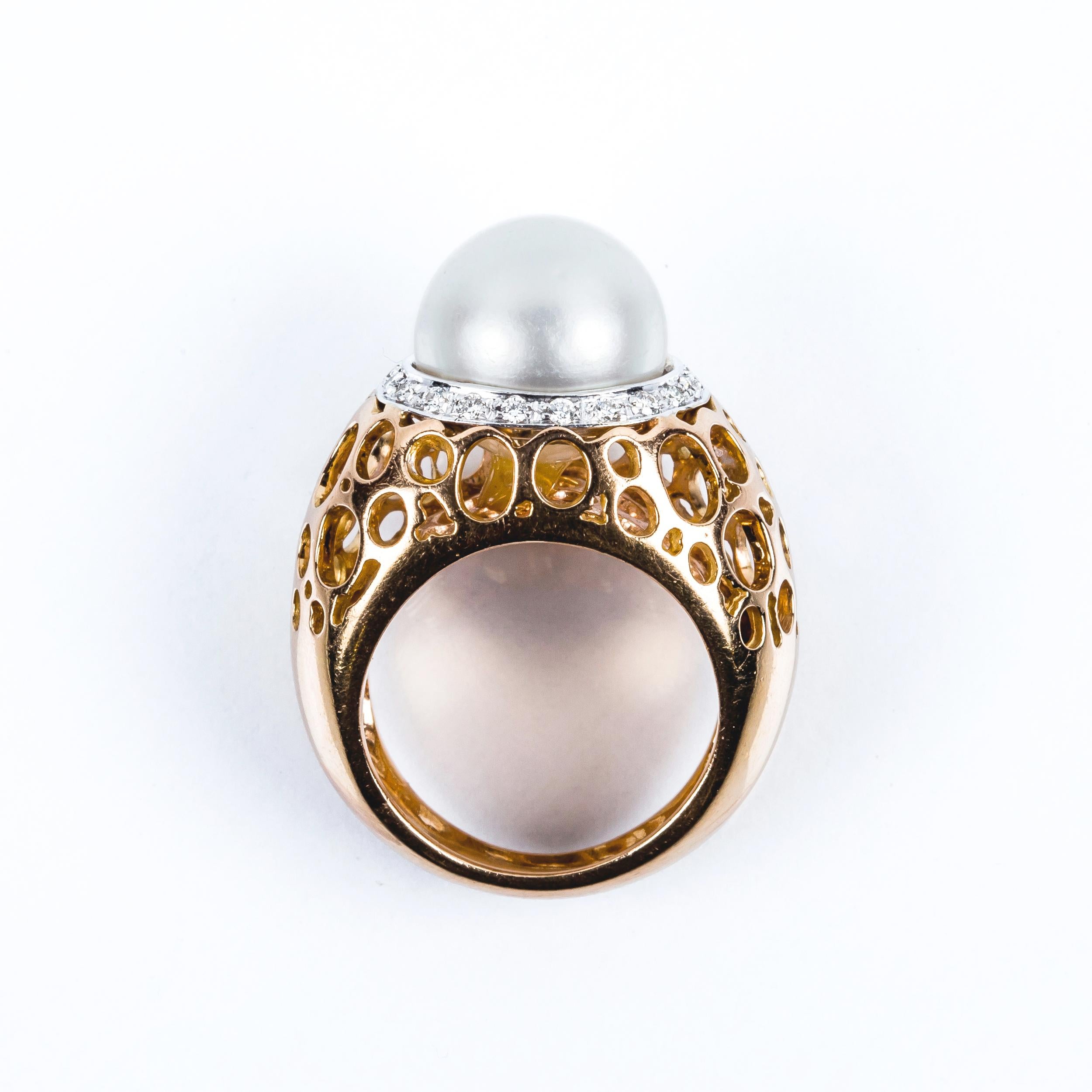 High Jewelry Design 18kt gold ring 
Natural Australian 12mm/  0.4724inches  pearl with very good proportions and light grey colour 
Halo Nest of 20 diamonds in 18kt white gold that total 0.1ct 
The structure of the ring is in 18kt rose gold and has