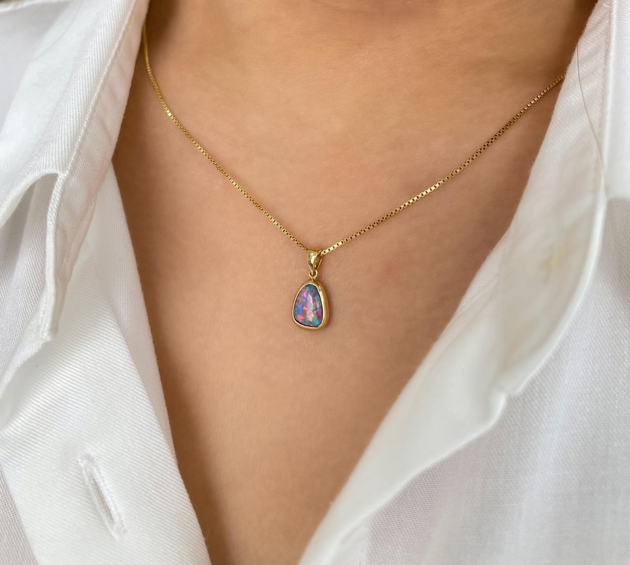 Breathtaking and radiant is the “Stacy” opal pendant featuring a wonderful and unique Australian opal doublet. Set in a graceful 18K yellow gold, the opal gemstone possesses a rare and fascinating play of colour that is absolutely captivating to the