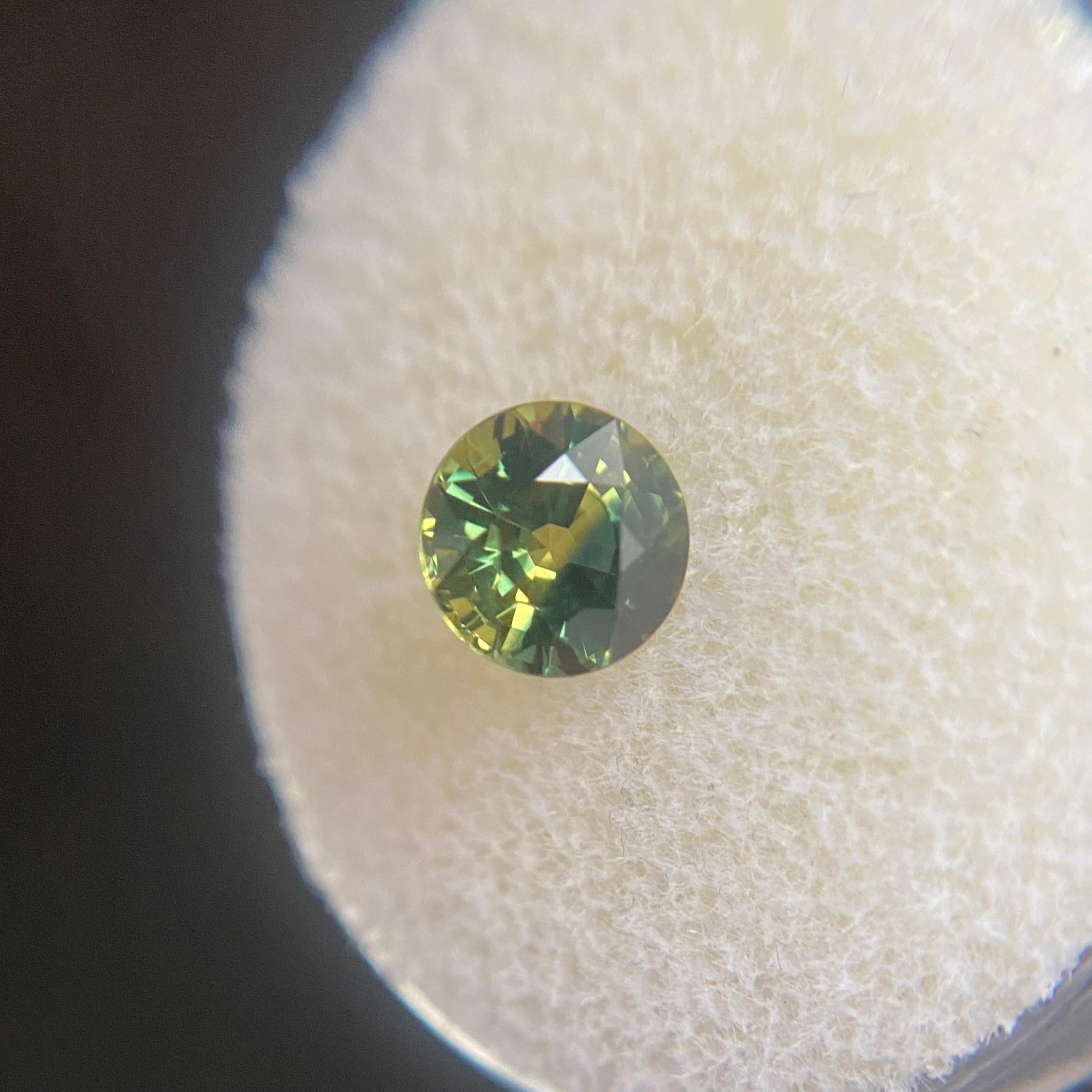 Yellow Green Bi-Colour Australian Sapphire Gemstone.

1.32 Carat with a beautiful and unique yellow green parti-colour and very good clarity, a clean stone. Also has an excellent round cut and ideal polish to show great shine and colour, would look