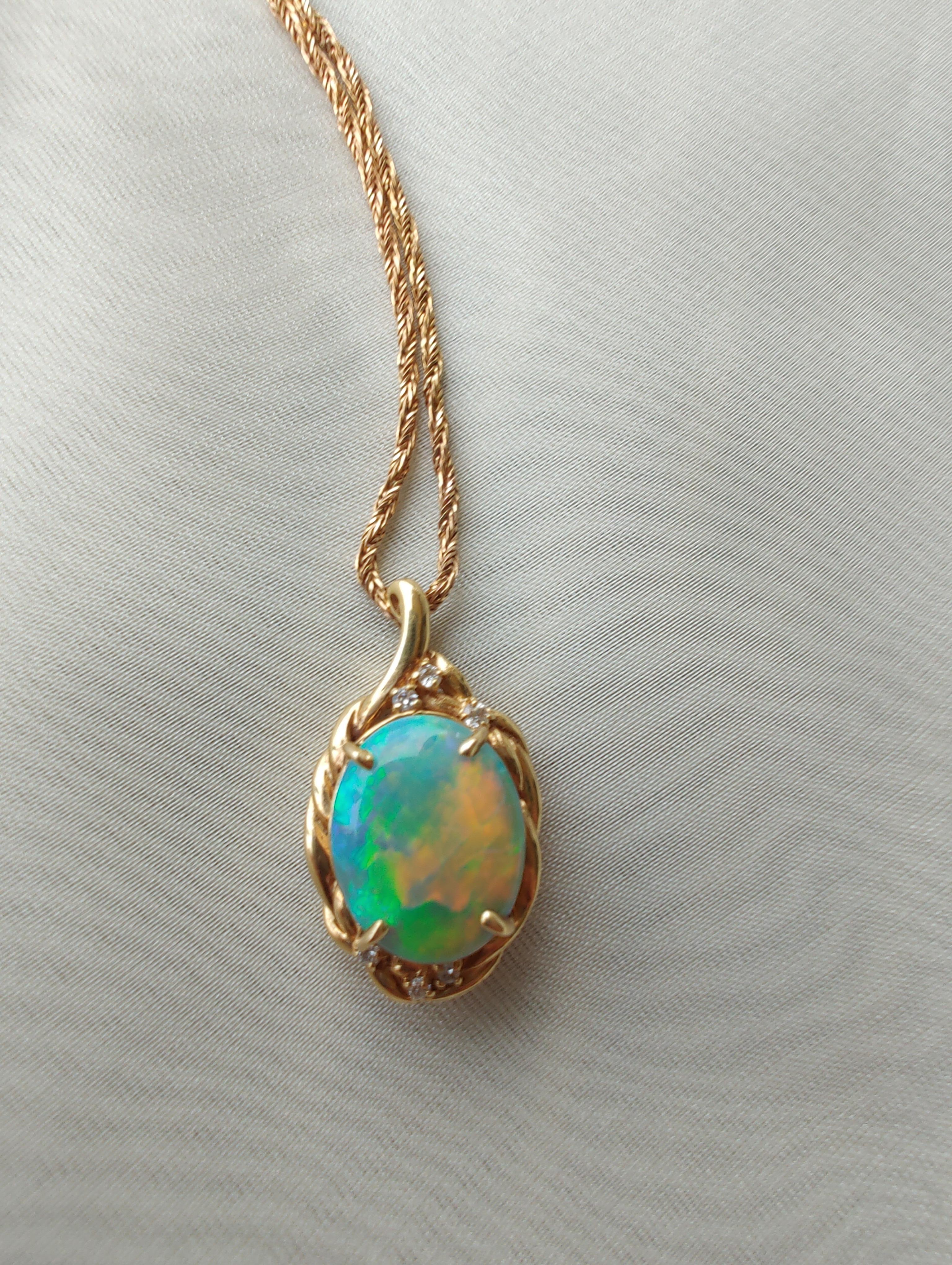 Set in our signature 18ct Yellow Gold, this pendant features a rare, natural solid 4.946ct Australian Black Opal
 (14.8 x 11.7 x 5.2mm) as its centre stone, showcasing the dazzling colours of the rainbow . This vibrancy of colour makes black opal