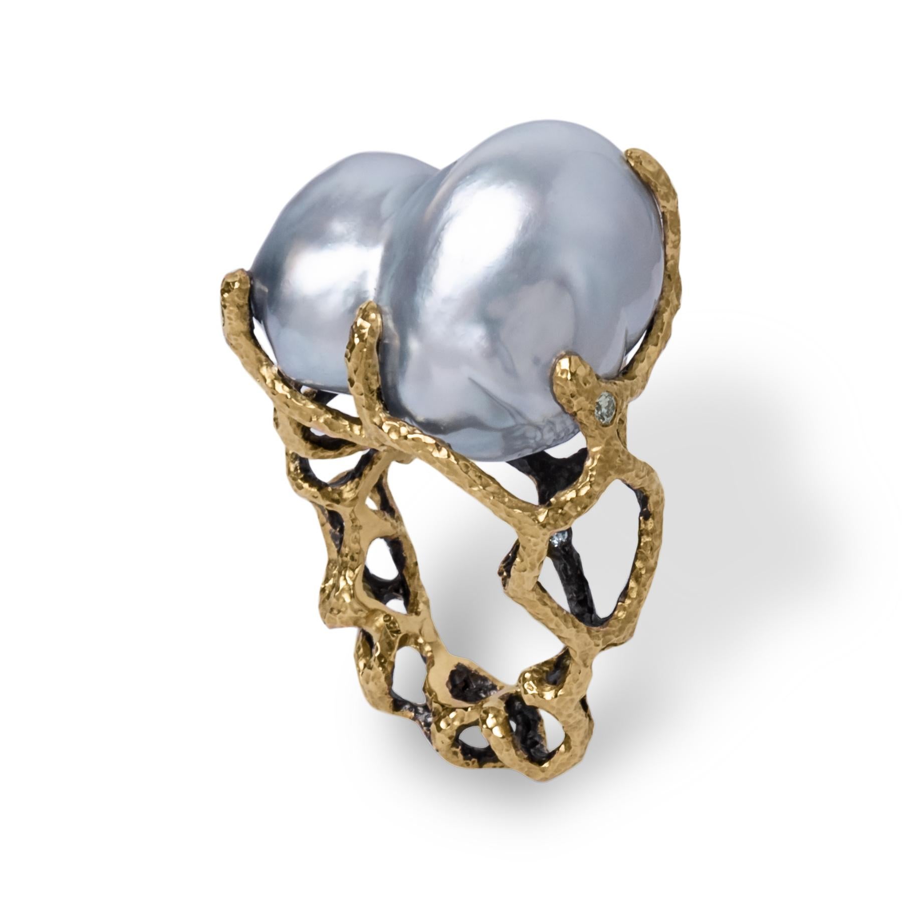 This one of a kind ring is from Lingjun's 'FISSURE' collection, featuring white Australian South Sea Baroque pearl. 

The unique organic lines of gold were custom carved to match the pearls' natural shape, allowing its audience to appreciate the