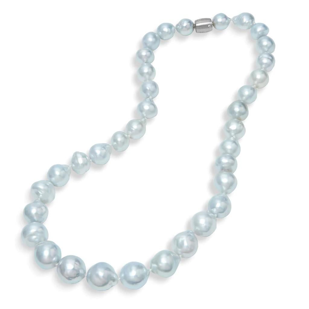 Thirty-five Australian South Sea Baroque pearls, measuring 9.3 – 13.90 millimeters, are strung together to create a spectacular piece. 0.08 carat of diamond (G/SI1) in flush setting on the 18 karat white gold snap fix flower clasp visually elevate
