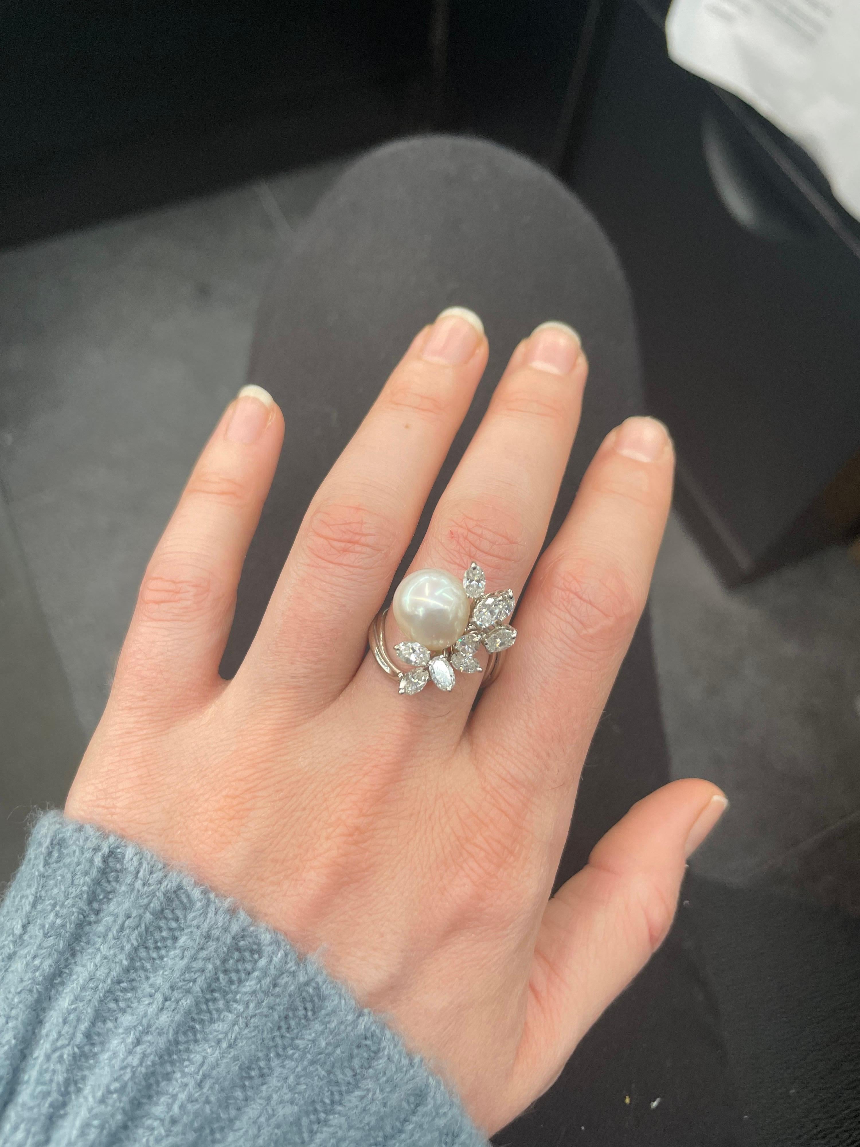 14 Karat White Gold cocktail ring featuring one Australian South Sea Pearl measuring 11-11.5 mm flanked with 9 oval diamonds weighing approximately 2 carats. 
Gem South Sea Pearl! 
