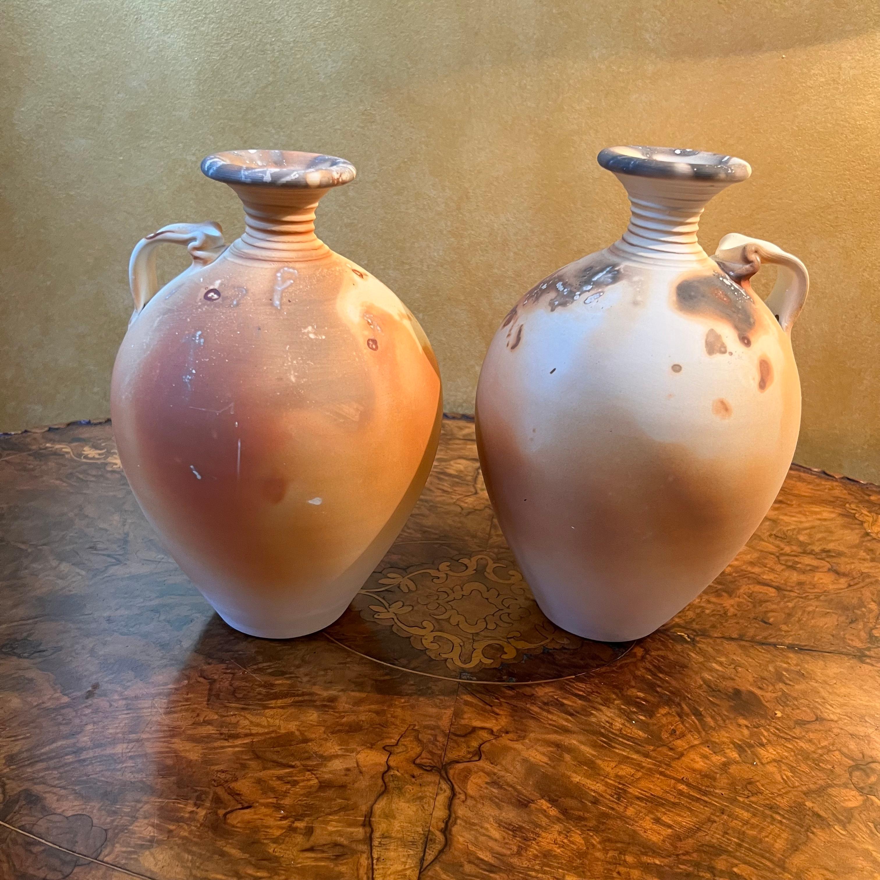 Decorative vases only water can no be stored in these. Sticker on base Made By Rod Pedler in South Australia 

Circa: 1980s

Material: Pottery 

Country Of Origin: Australia   

Measurements: 24cm high, 13cm diameter (middle)

Postage via Australia