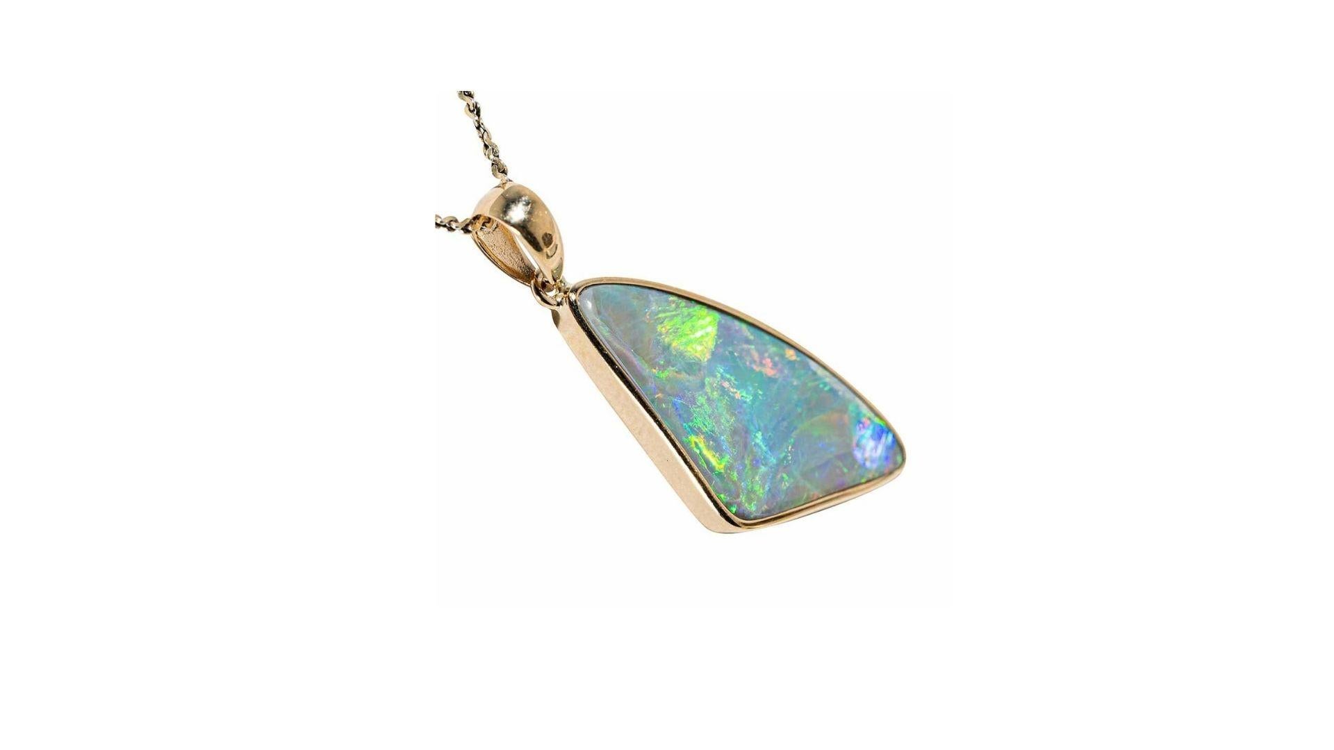 This Intricate 14kt Gold Australian Solid White Opal Necklace shines bright with dreamy multi colored rainbow brilliant flashes including red, gold, pink, green, blue, yellow, orange and purple (among many other colors) that radiate and dance in the