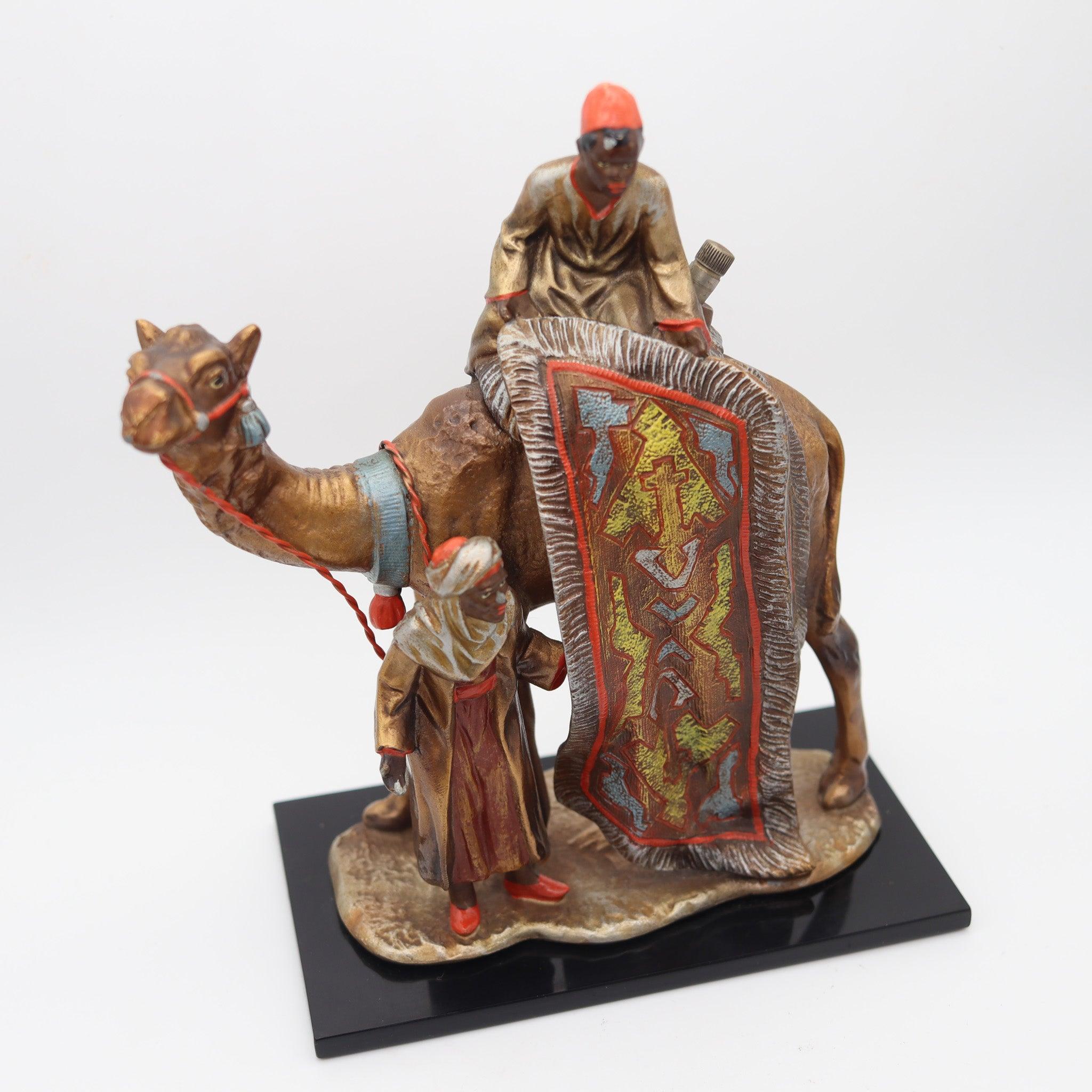 An art deco desk striker made in Austria, attributed to Franz Xaver Bergman.

This is a gorgeous original early Art Deco sculptural desk-striker lighter, depicting two Arabian moorish carpets vendors in a camel. The whimsical piece is very