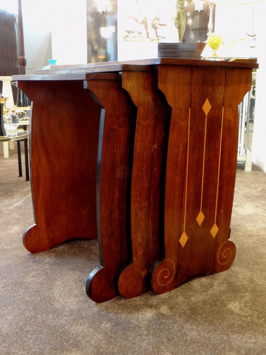 Beautiful set of Austrian nesting tables in wood inlaid Art Deco period. The design and the quality of the decor are typical of the influence of Viennese secession which was felt until the 1950.

Austria, 1920-1930.

Dimensions of the largest:
