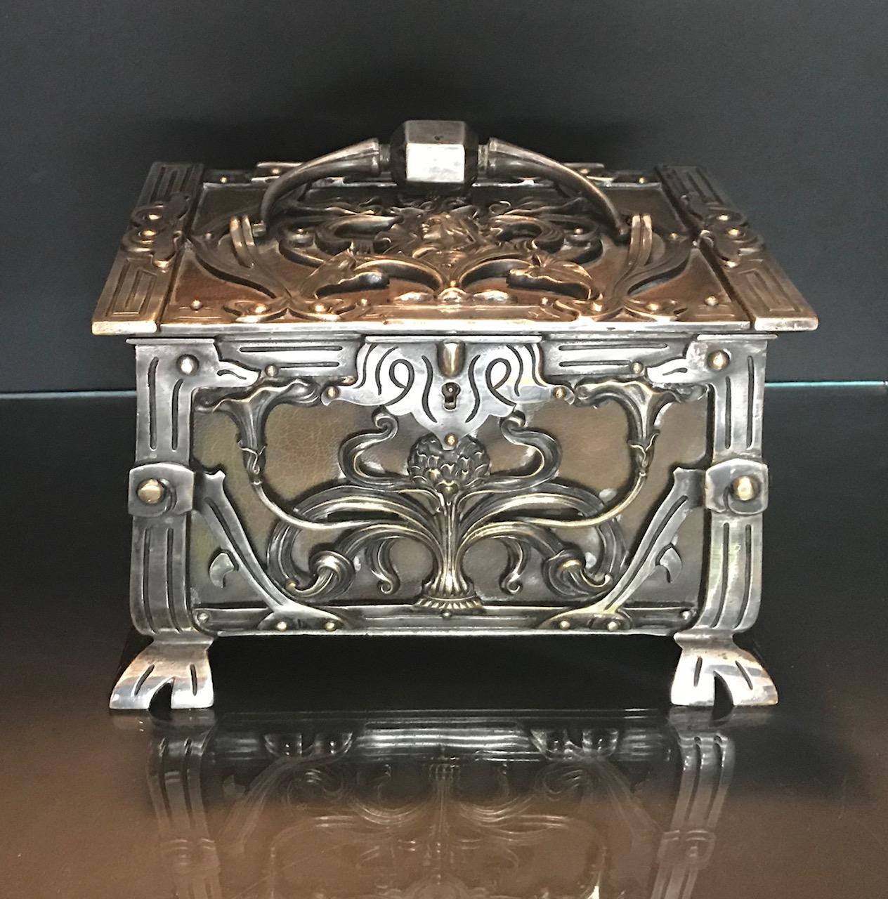 Austria/France Art Nouveau silvered heavy bronze jewelry box casket, circa 1900

This is an important and exquisite Art Nouveau footed silvered bronze jewelry box. The ornate bronze floral design covers the four sides of the box. The top has a