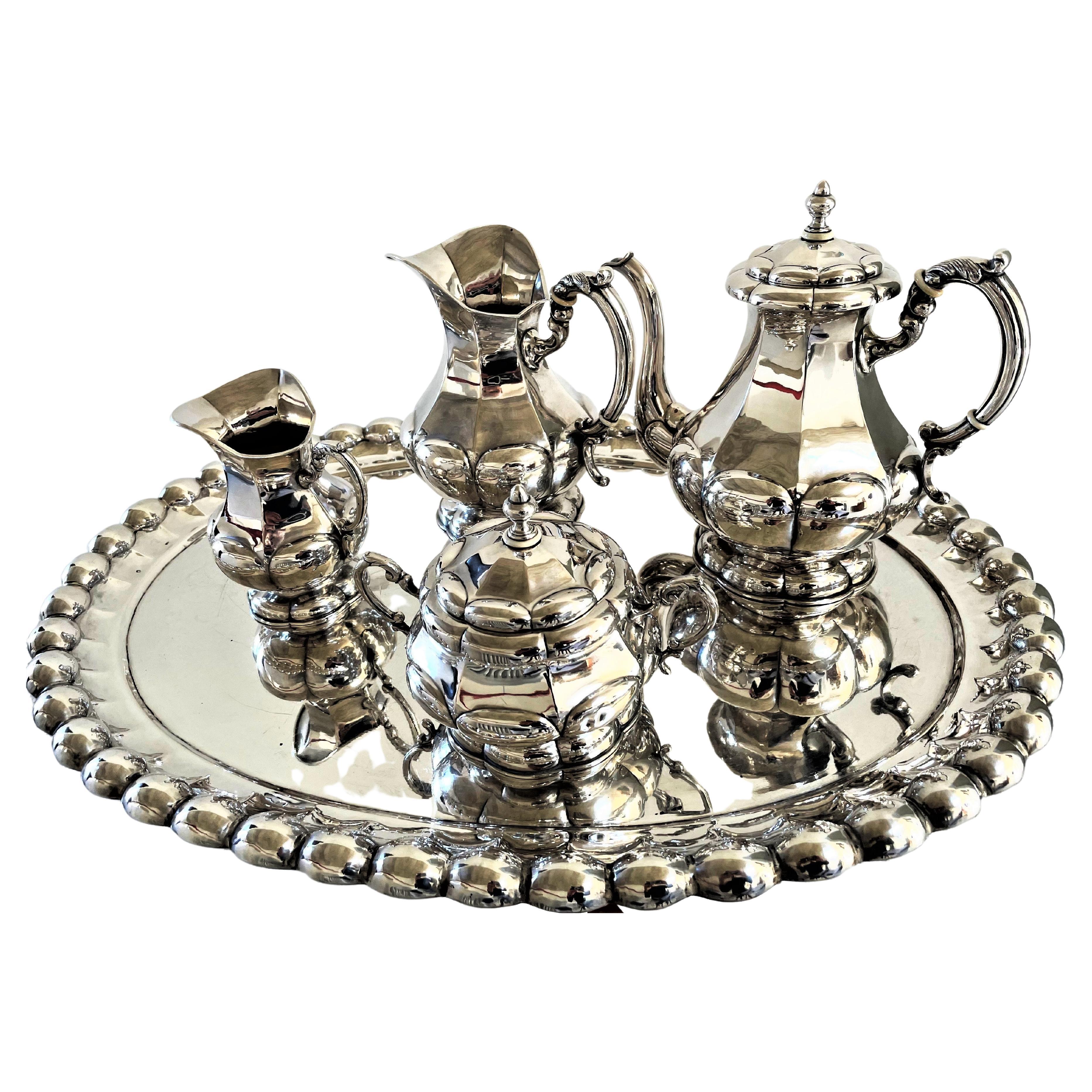 An exceptional, Impressive 4 parts Coffee service that stands on the tray made for it. All parts are hallmarked with the Austria - Hungarian DIANA head from 1870. Total weight of 5 parts 4 324 grams /900 sterling
Measurement: 
The tray :      