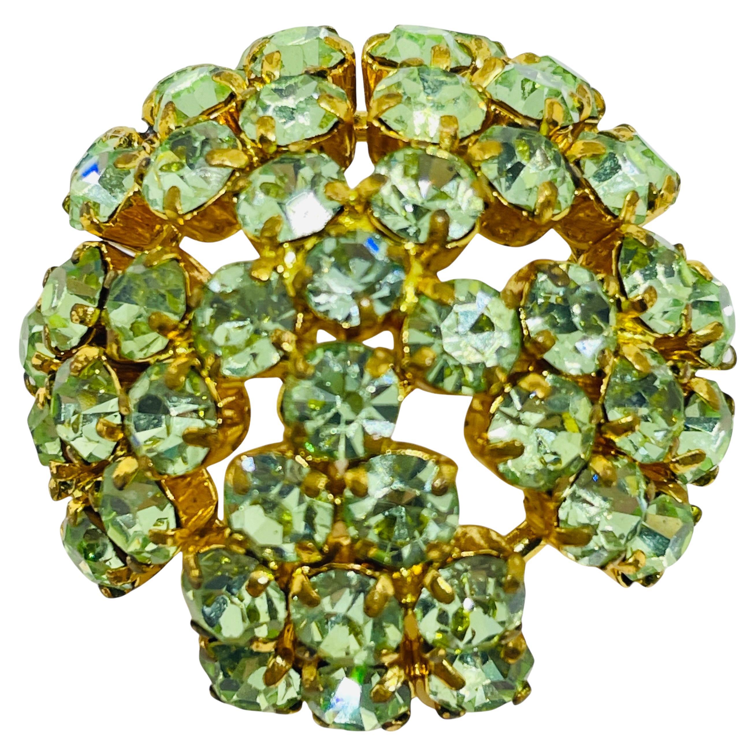 Spilla firmata AUSTRIA con strass d'epoca in tono dorato