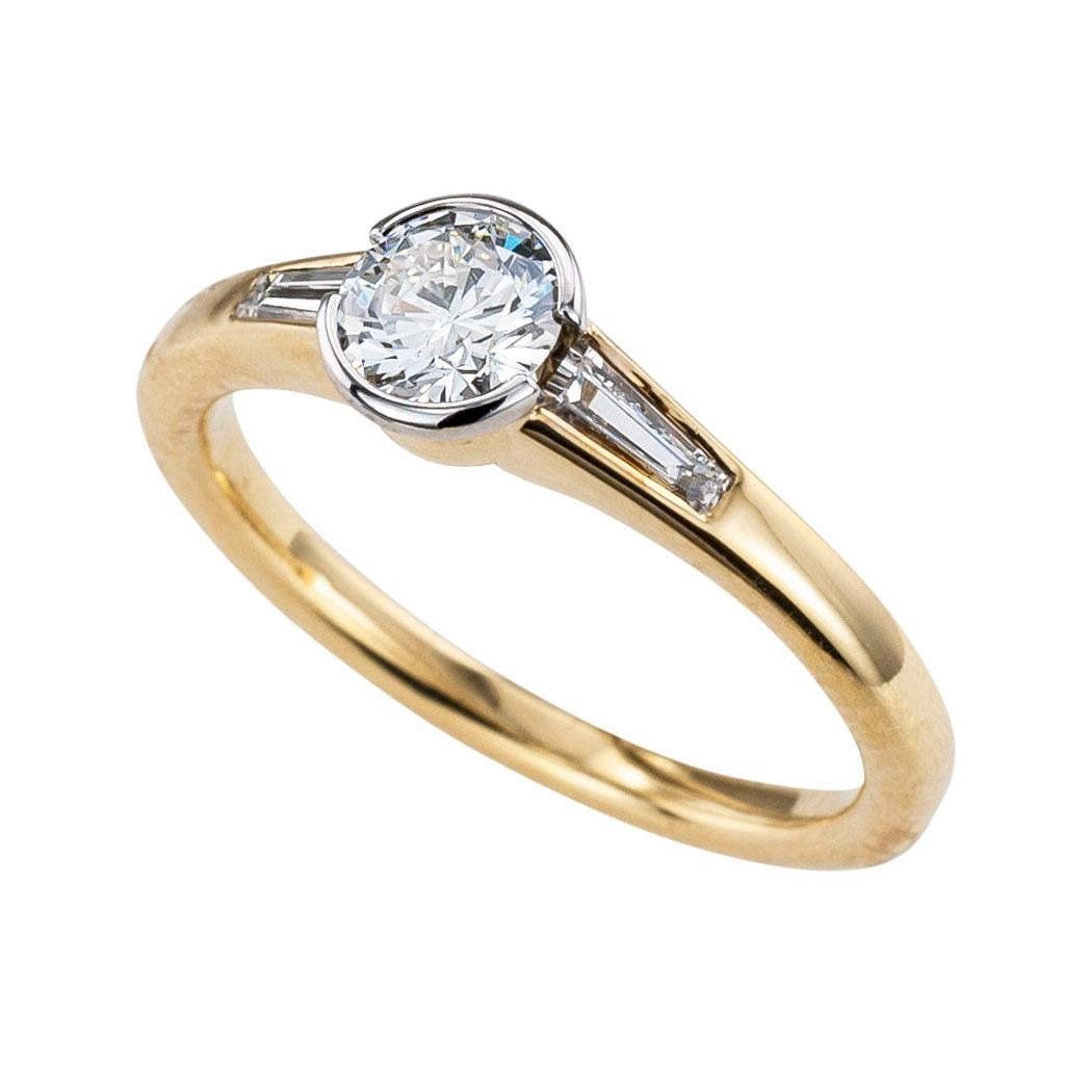 Austrian 0.42 carat round diamond and yellow gold engagement ring.  Love it because it caught your eye, and we are here to connect you with beautiful and affordable jewelry.  Simple and concise information you want to know is listed below.  Contact