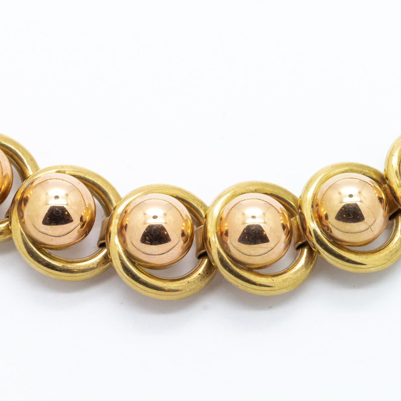 A 1940's yellow and rose gold necklace, comprising of gold ball and circle links in 18ct gold.  With Austrian marks. Approximately 16