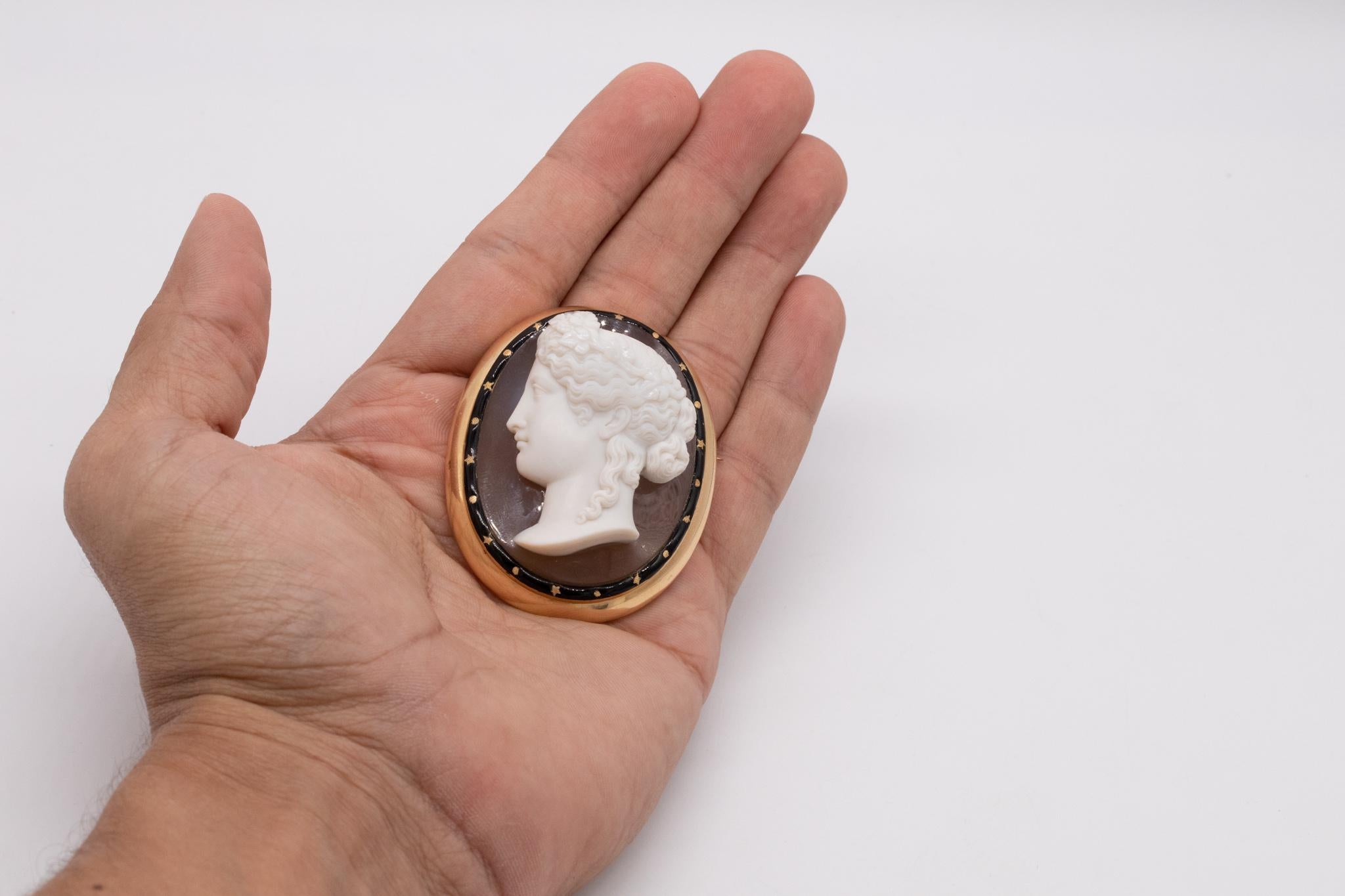  An Austrian carved agate cameo of Heba.

This piece feature a fabulous three-dimensional cameo piece, carved from a two layered natural agate, with gradations of colors; from translucent orange brown to frosted white.

The quality of the carving is