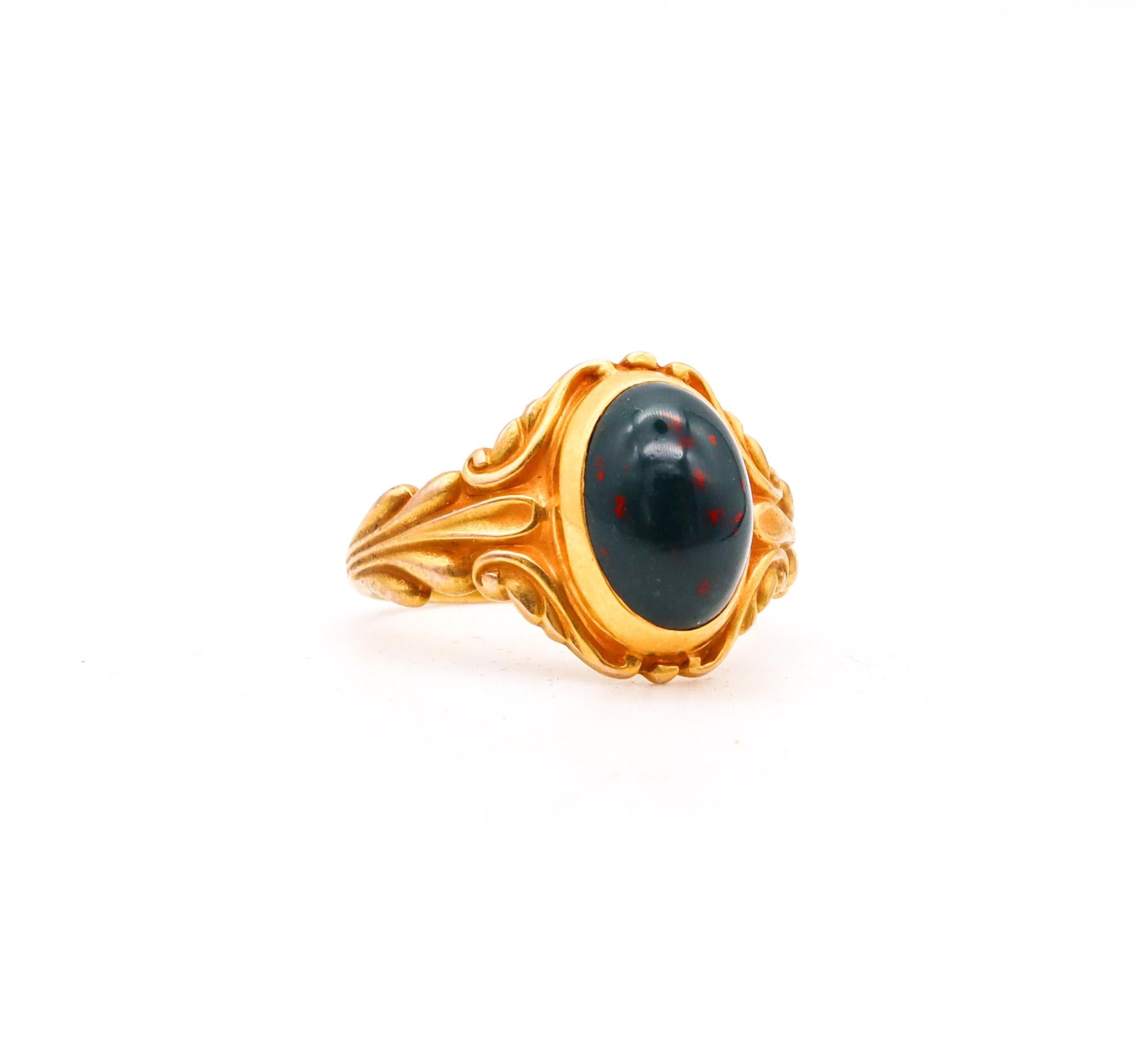 Austrian art nouveau ring with bloodstone.

A highly decorated ring, created in Austria or probably Germany during the early art nouveau period, back in the 1890. This beautiful ring has been crafted with intricate curved scrolls motifs in yellow