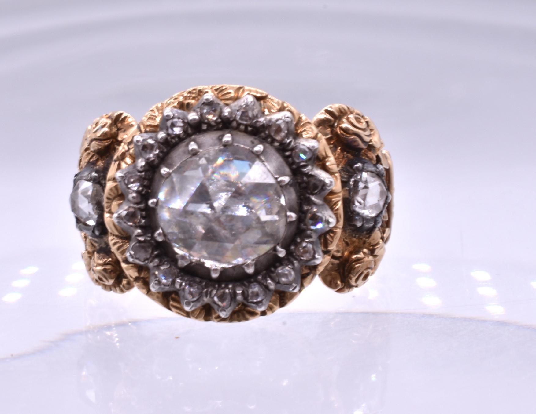 Ornate 18K Georgian repousse rose cut diamond ring which likely belonged to someone of nobility. This lavish Austrian or German ring pulls out all the stops with its intricately carved band and gorgeous rose cut diamond mounted in silver 
