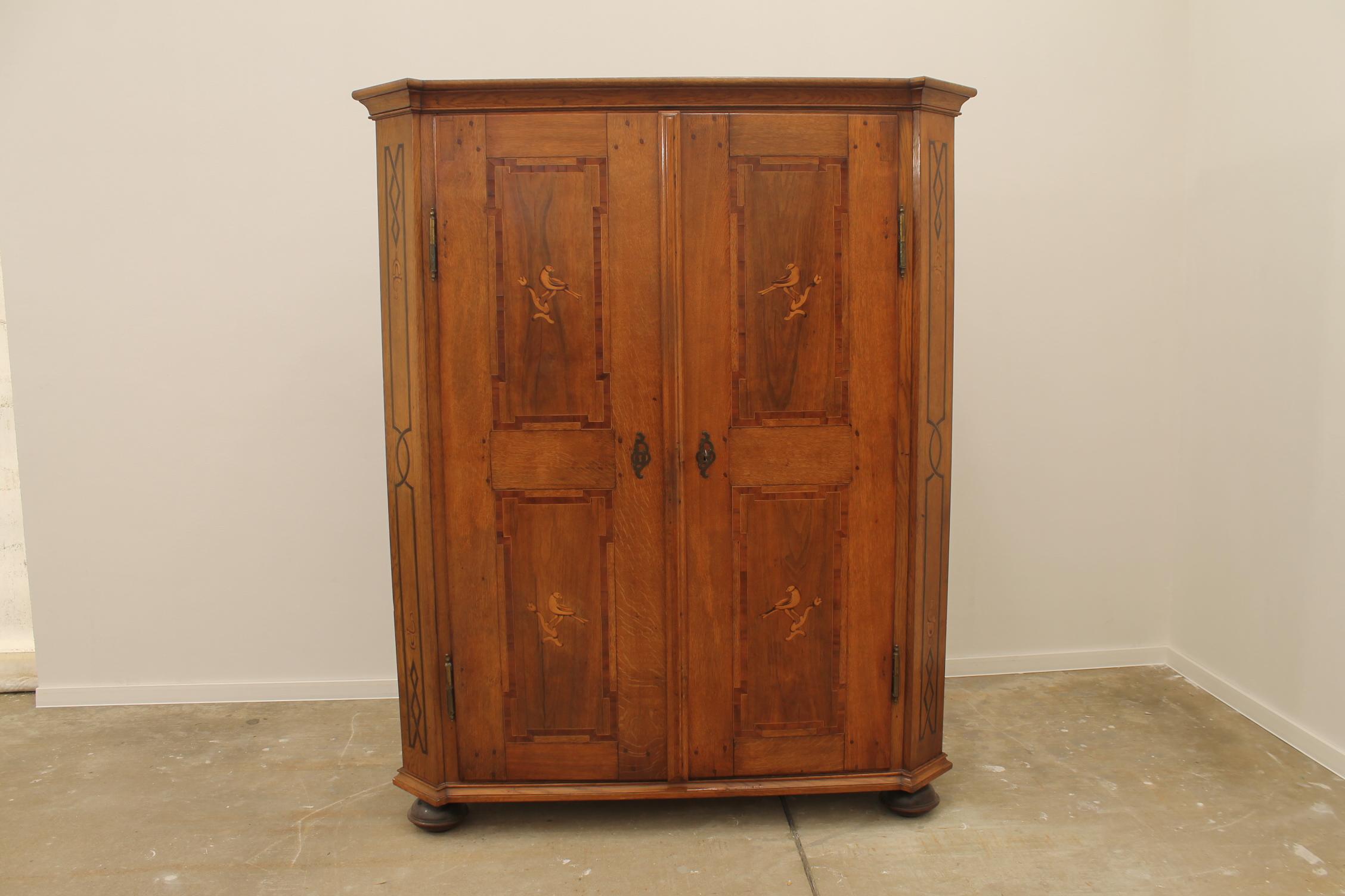 Original Baroque wardrobe from the late 18th century. It was made in the former Austro-Hungarian Empire.  The wardrobe features an original fittings, original Baroque lock. The wardrobe is made of oak solid wood with walnut inlay. It is in very well