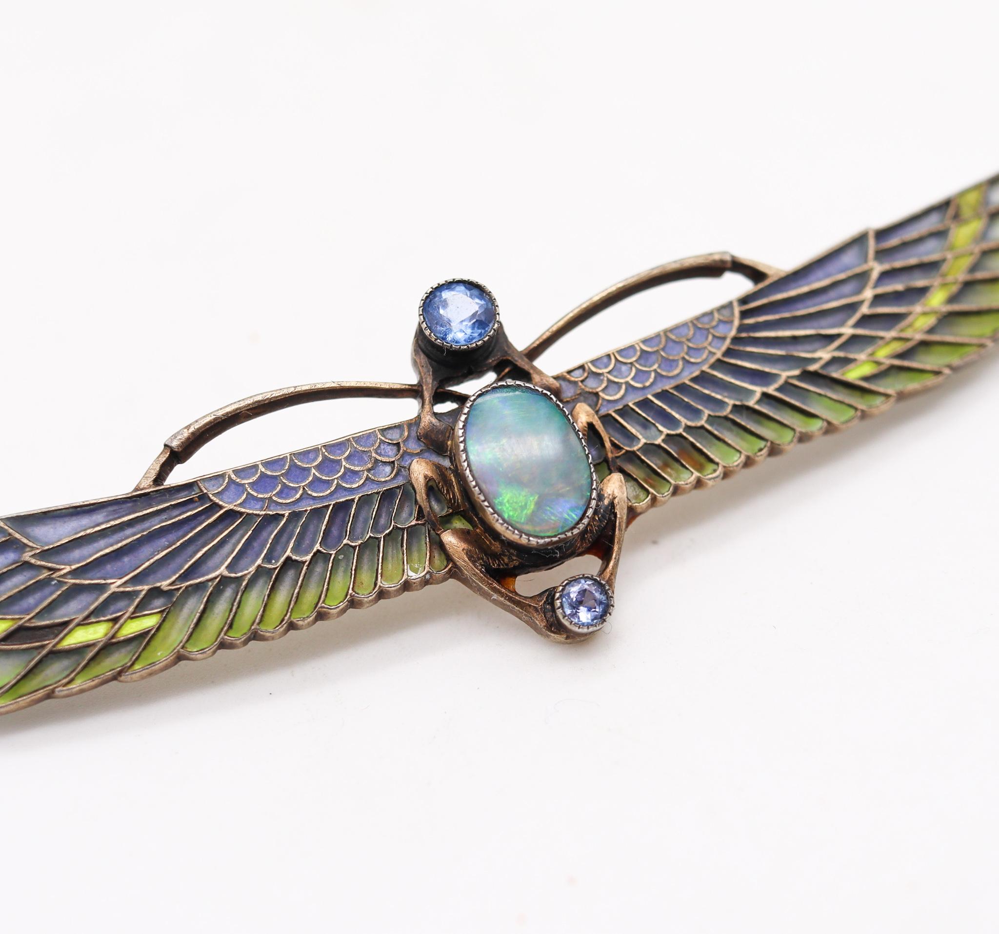 Austrian Egyptian revival Plique à Jour winged Scarab brooch

An exceptional elongated brooch, created in Austria during the art nouveau period, back in the 1915. This magnifique piece has been carefully crafted with the egyptian revival style, in