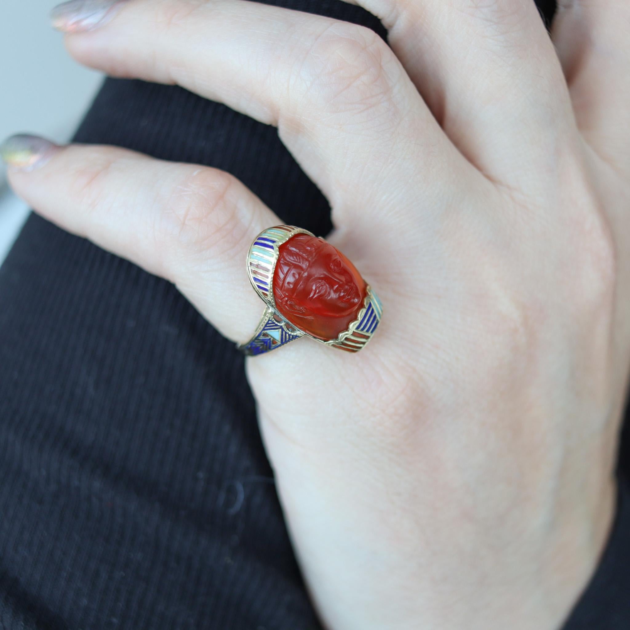 Egyptian revival carved Pharaoh ring.

Beautiful European antique ring, most probably created in Vienna Austria during the art deco period back in the 1915. It was crafted with exceptional Egyptian revival patterns in solid yellow gold of 14 karats