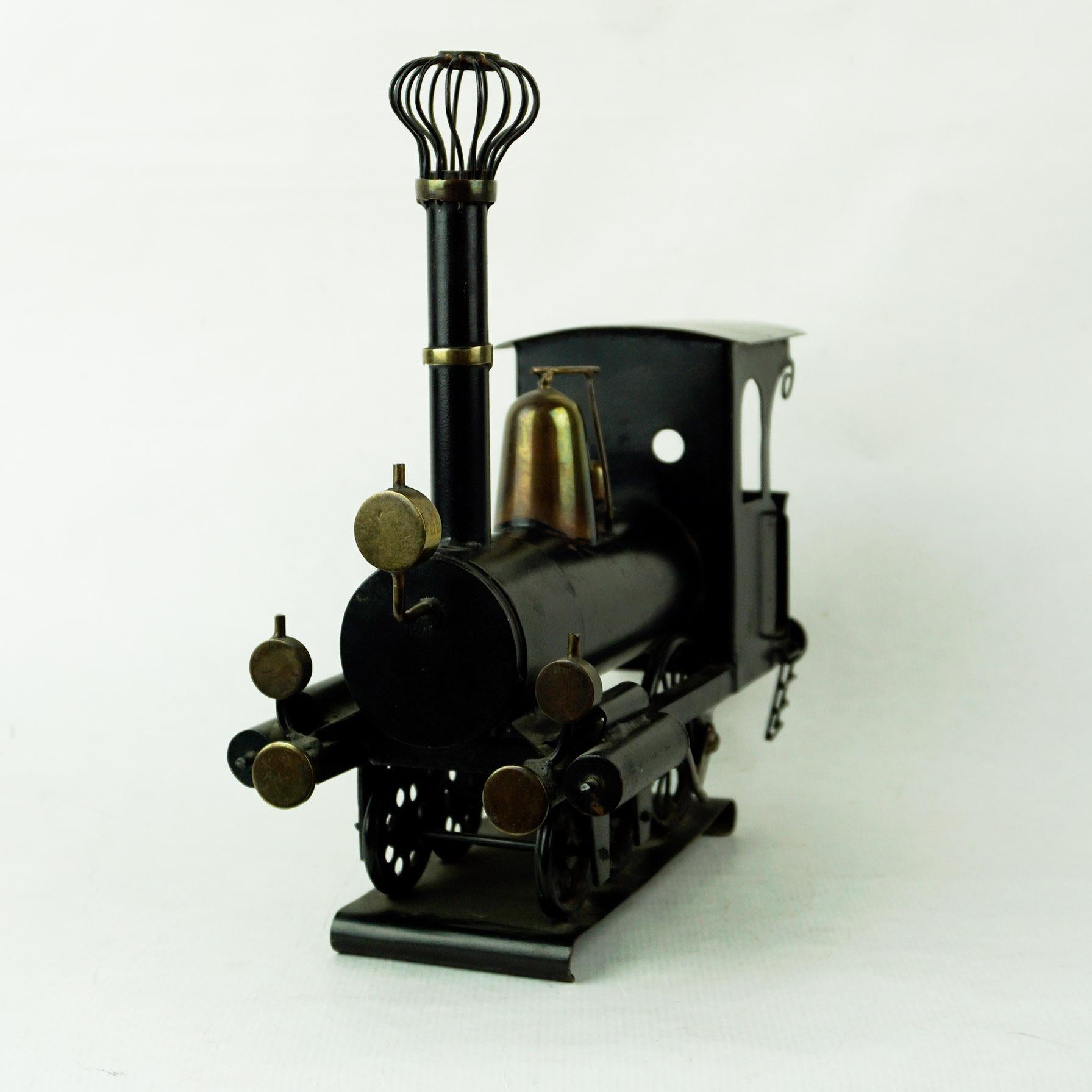 Mid-Century Modern Austrian Midcentury Brass and Black Metal, Locomotive by Hagenauer Vienna For Sale