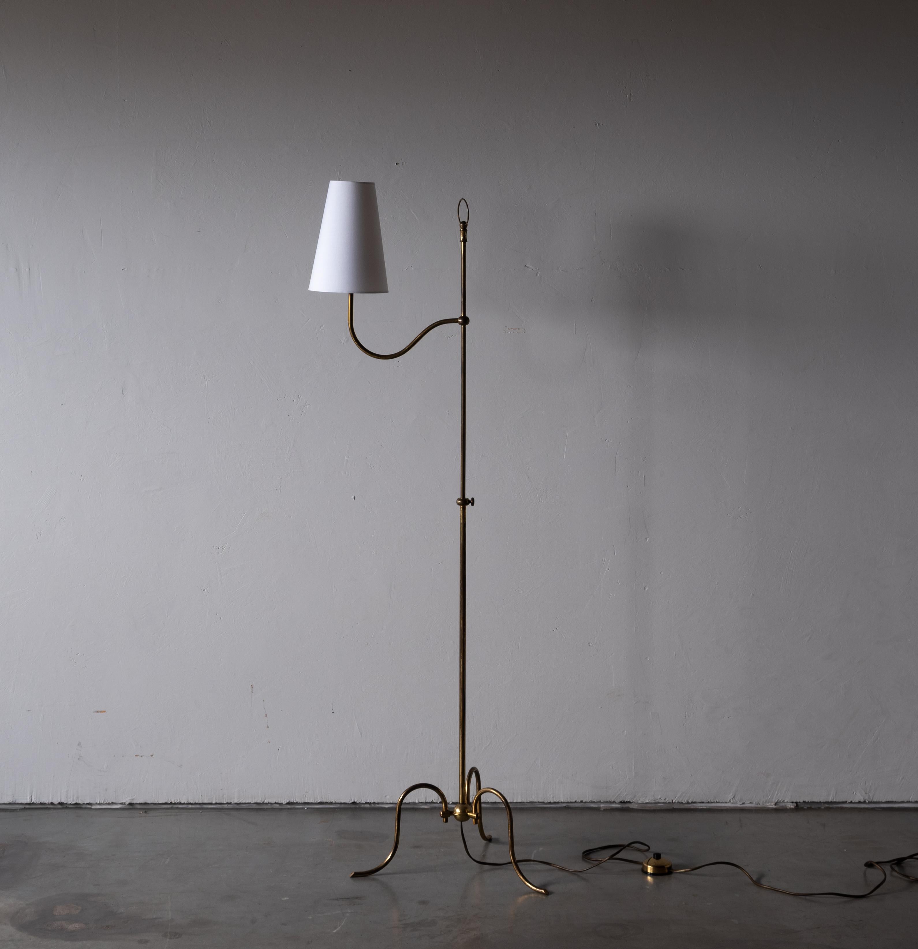 An adjustable functionalist floor lamp. Designed and produced in Austria, c. 1940s. In brass. Brand new lampshade.

Dimensions stated measured with lampshade attached.