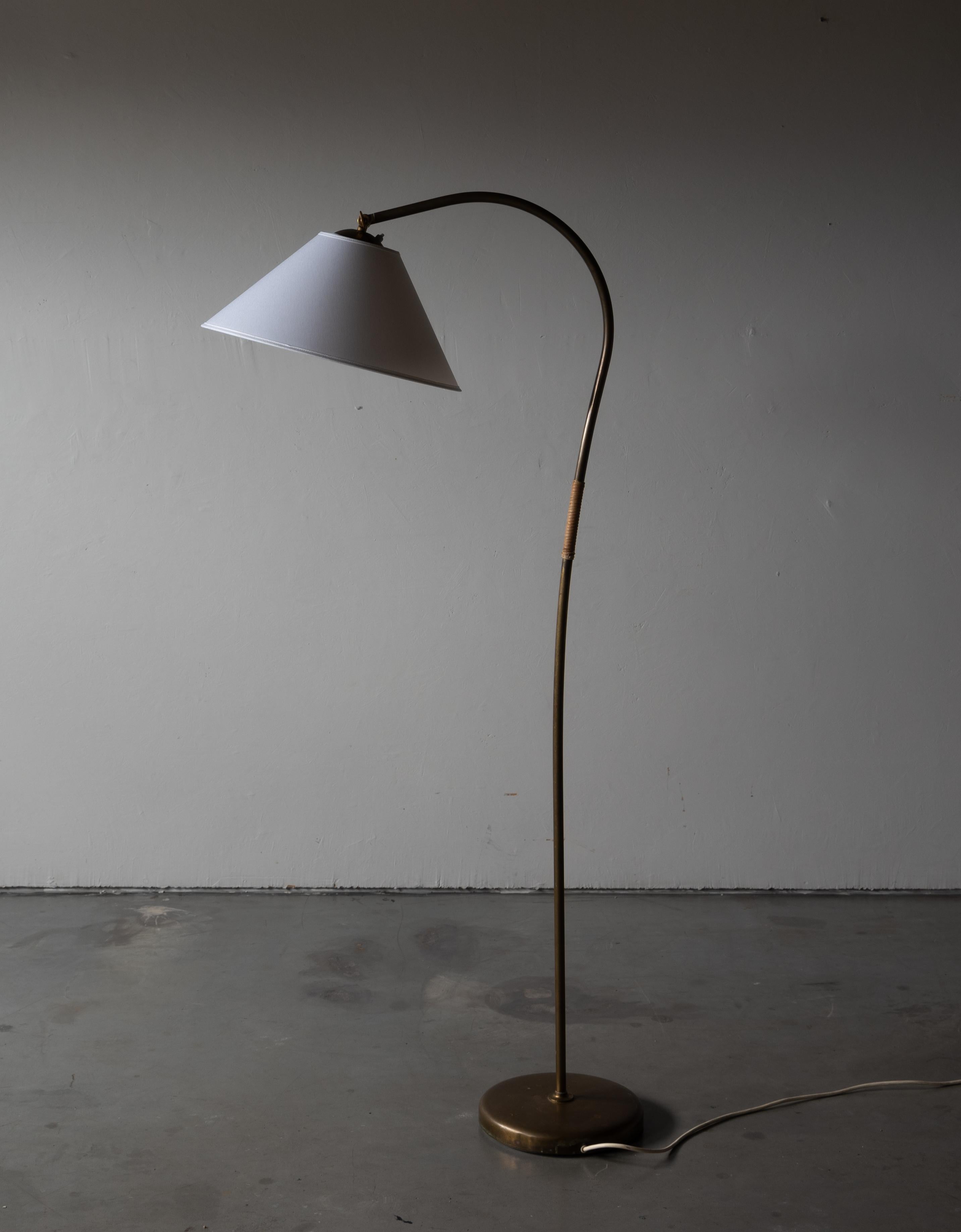 An adjustable functionalist floor lamp. Designed and produced in Austria, c. 1940s. In brass. Brand new lampshade.

Dimensions stated measured with lampshade attached.