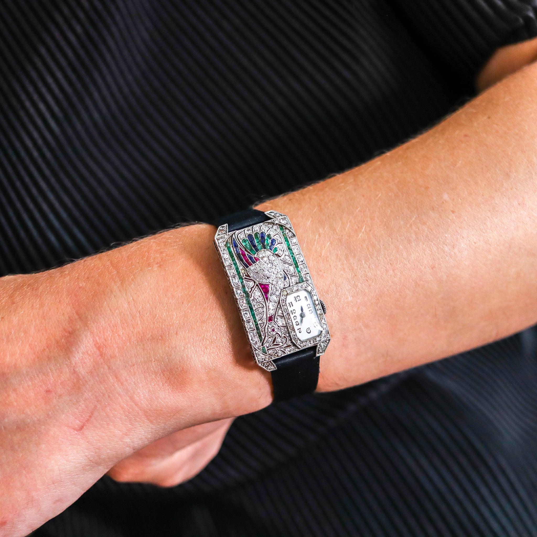 An art deco curvex wristwatch in platinum with gemstones.

This is an absolutely gorgeous wristwatch, created in Austria during the art deco period, back in the late 1920's. The case has been crafted in a rectangular curvex shape in solid .950/.999