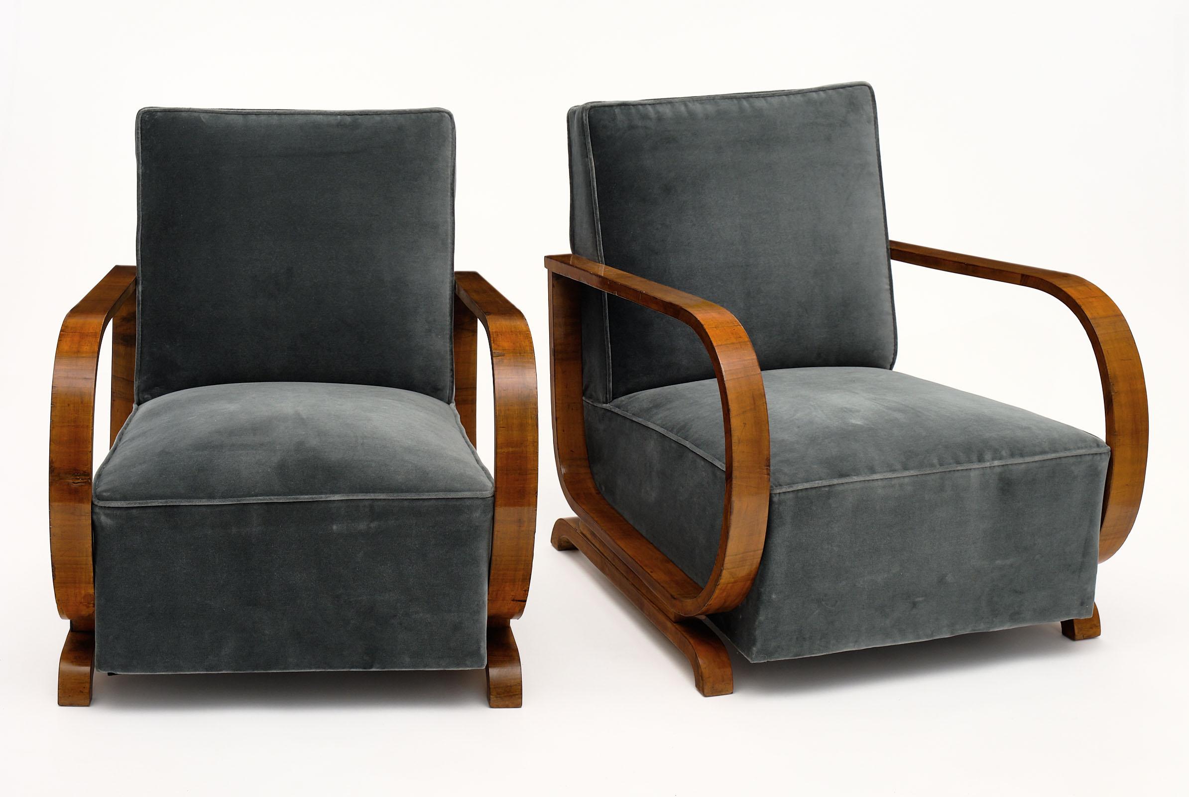 A pair of Art Deco Austrian armchairs from Vienna; reupholstered in a new gray velvet blend. The frame and curved arms are made of a beautiful figured walnut veneer. We couldn’t resist the comfort and impeccable lines of these.
