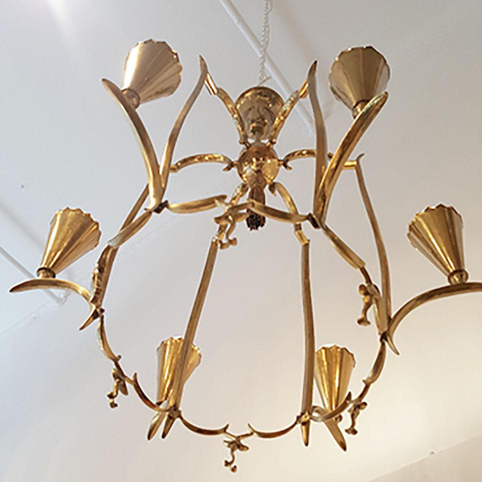 This charming Austrian Art Deso Brass Chandelier has been designed and manufactured ca 1920 in Vienna. Its Design and excellent craftmenship is very close to works of Dagobert Peche. It features a floral brass body with 6 E27 light sockets and is in