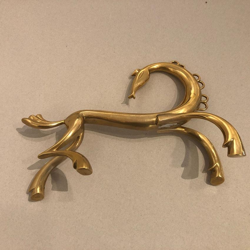Amazing iconic polished brass Horse sculpture designed by Karl Hagenauer and manufactured by Werkstätte Hagenauer Vienna in the 1950s, marked on the underside of one leg Hagenauer Wien, WHW.
The Provenance of this charming piece is from the famous