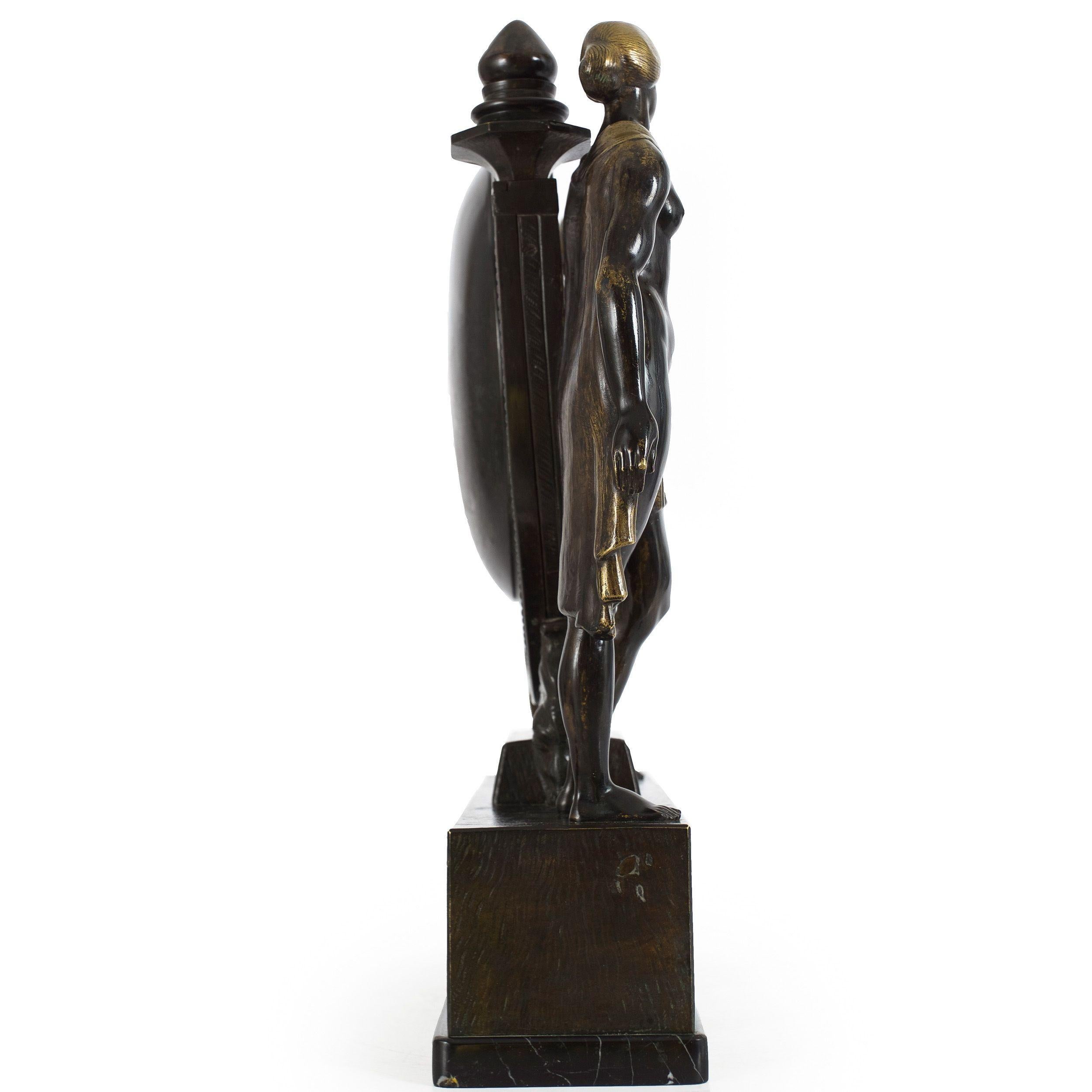 ART DECO FIGURAL MANTEL CLOCK
Anton Grath (Austrian, b. 1881)  patinated and burnished bronze over marble  signed 
