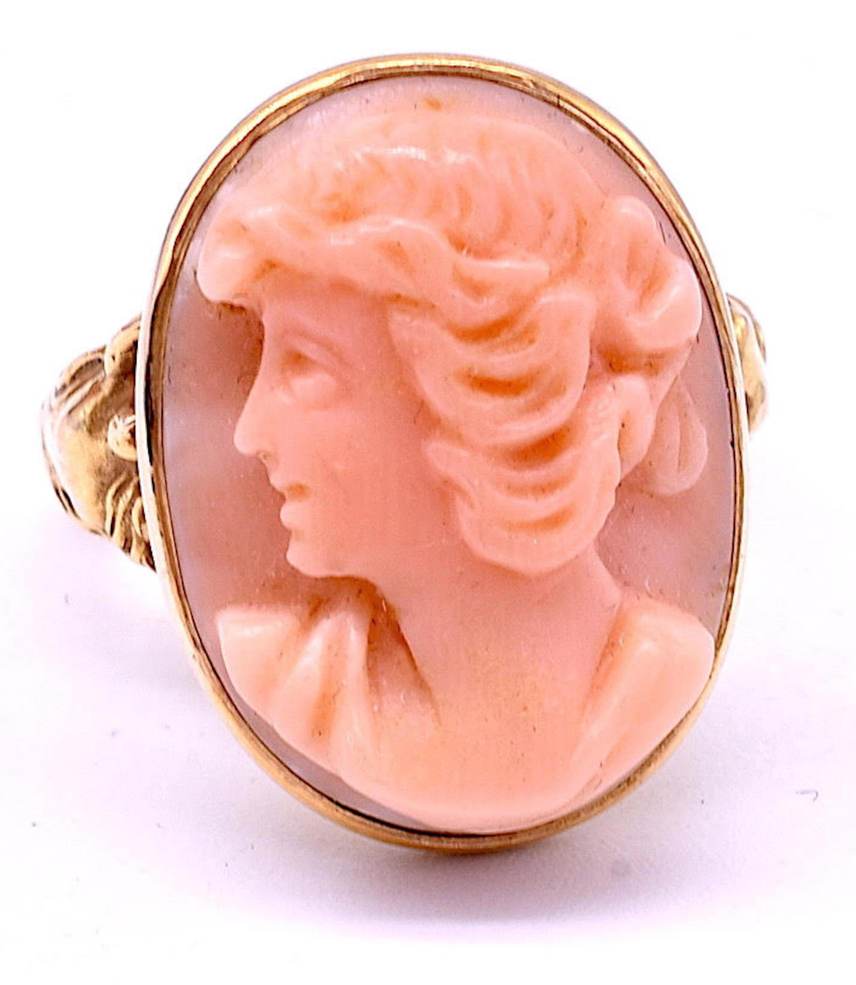 Few Art Nouveau jewelers found the tiny scale of the ring suitable for their sculptural creations, but the maker of this ring pulled it off. Our cameo ring shows an angel skin coral maiden supported on each side by a curvy nymph with long flowing