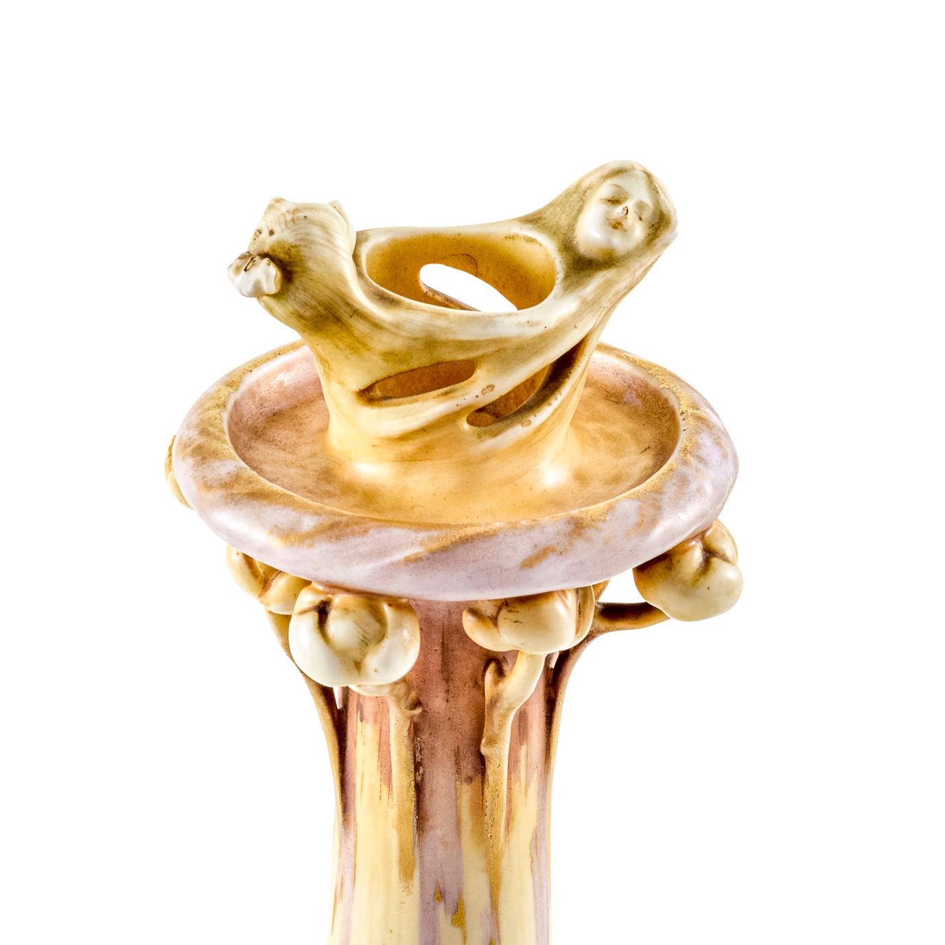 Austrian Art Nouveau ceramic candlestick from the “Fates-series” designed by Eduard Stellmacher manufactured by Amphora-Werke Riessner, Stellmacher & Kessel Turn-Teplitz circa 1902 ivory porcelain white yellow ochre brown marked

The candlestick