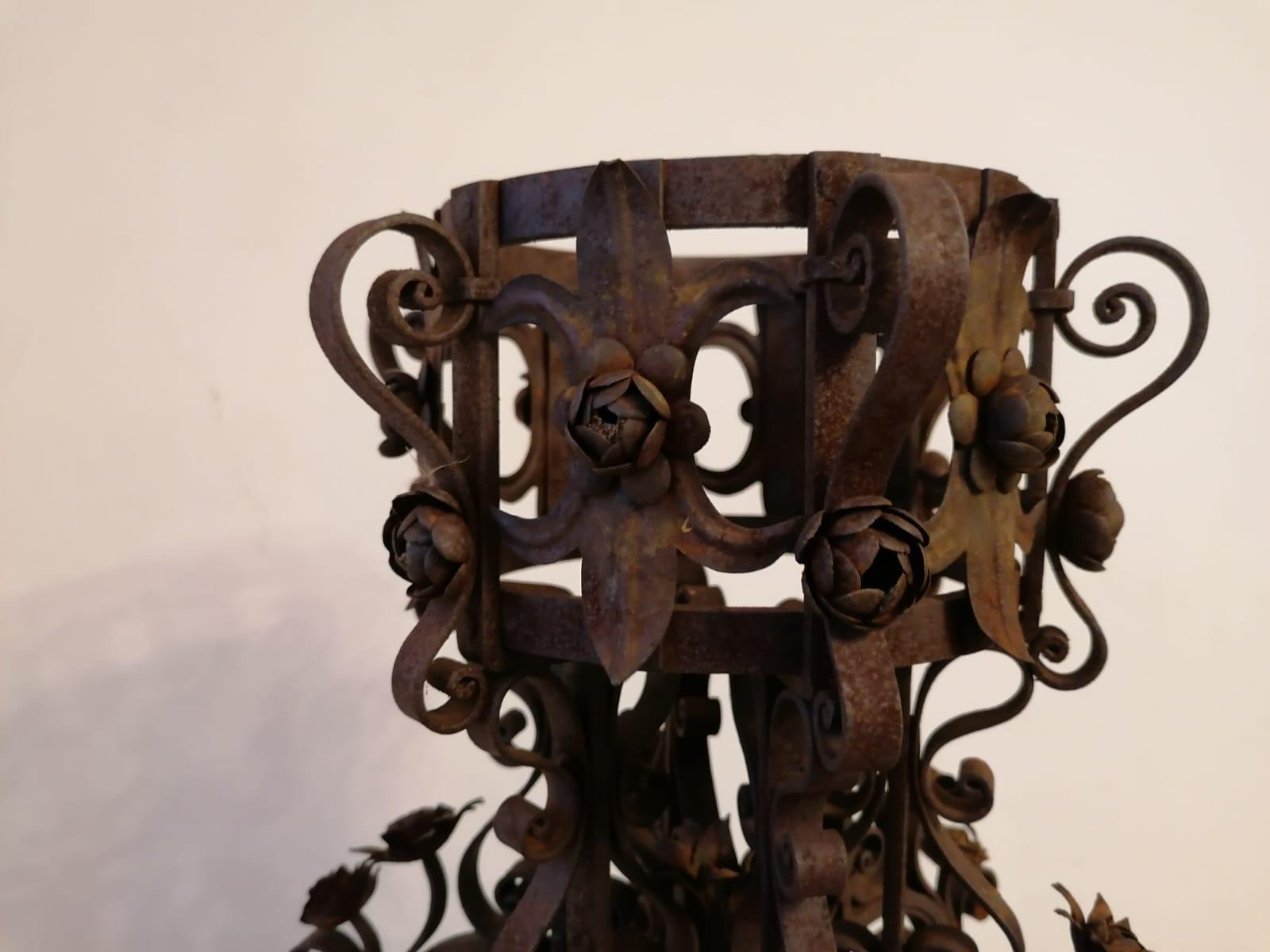 Beautiful Art Nouveau stand in rusted forged iron. Spectacular workmanship of great artisan quality. Fully decorated with flowers, curls and swirls made of forged iron. Iron has a beautiful particular antique patina.