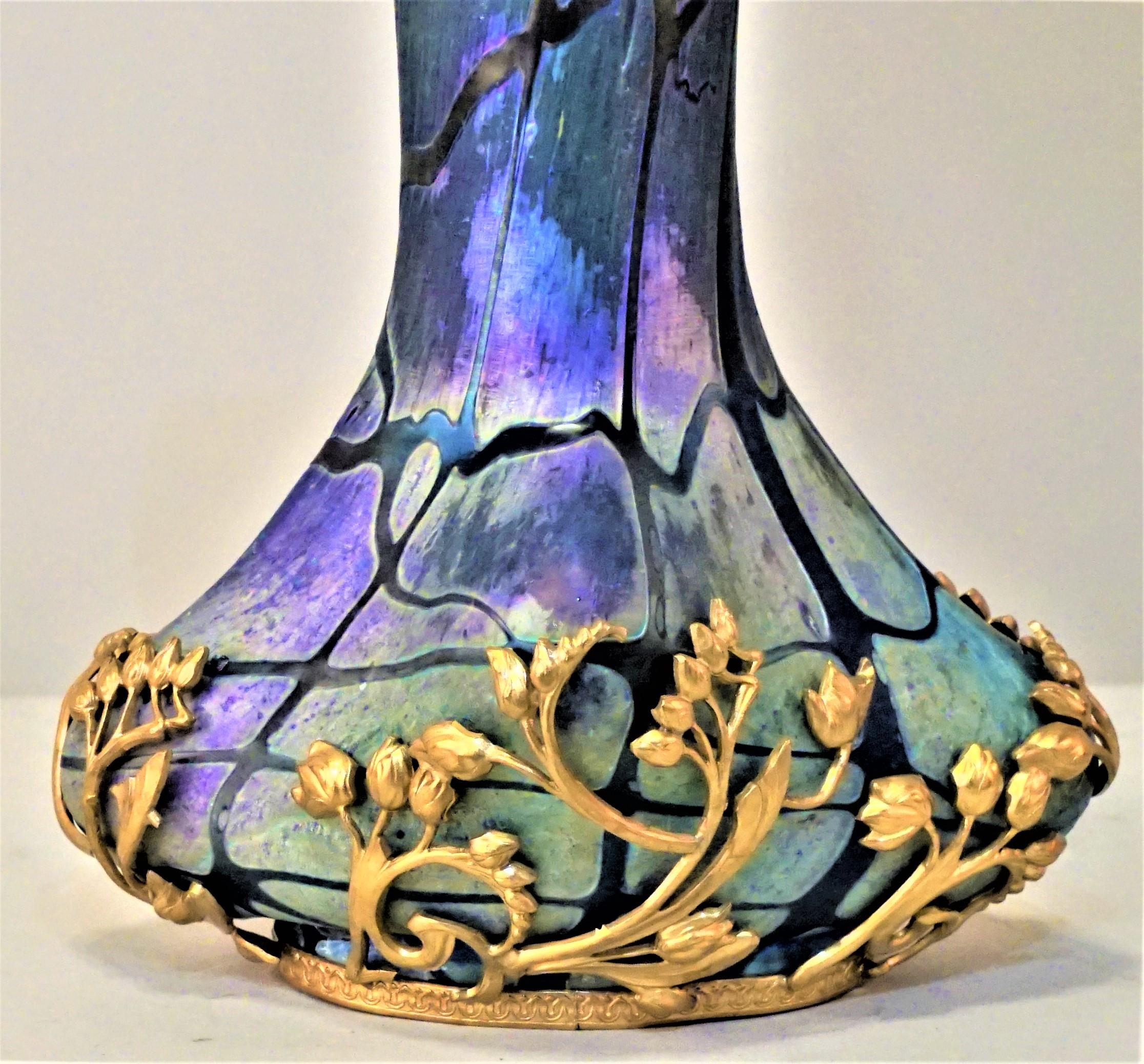 Hand blown art glass with bronze decoration.