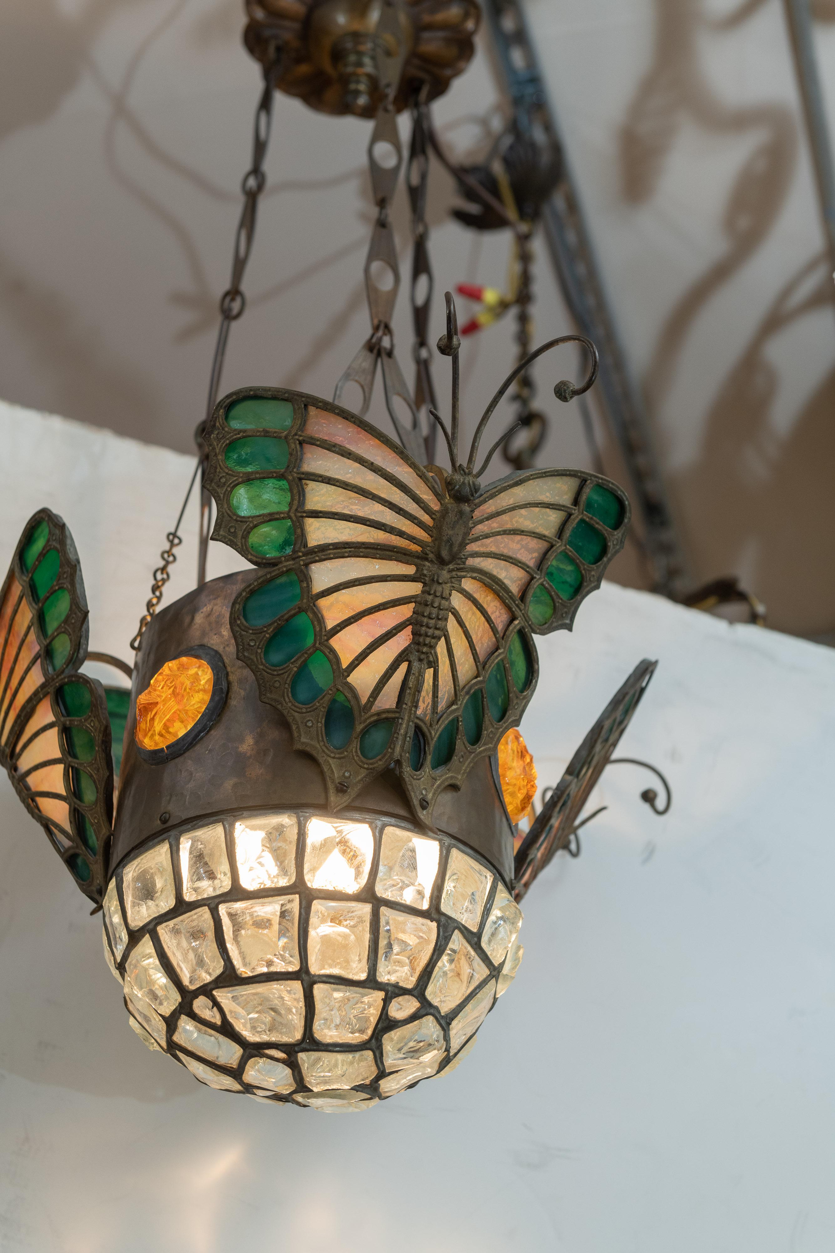 This is quite an exceptional piece of lighting. We purchased it right out of the home of a 93 year old collector who was moving to an assisted living home. We were very lucky to get the call first. I have seen lots of chunk glass lighting, but