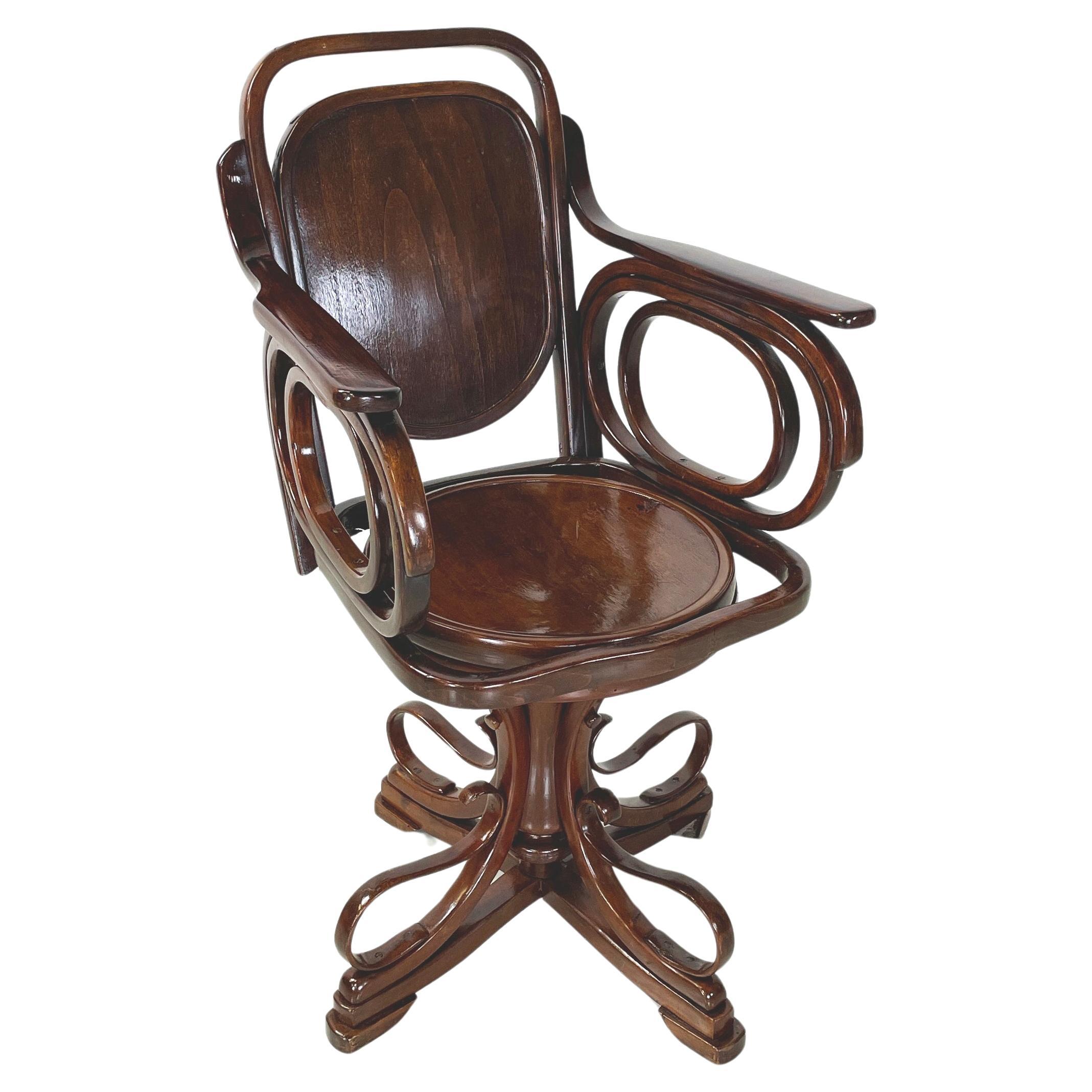 Austrian Art Nouveaux Swivel chair with armrests in wood by Thonet, early 1900s