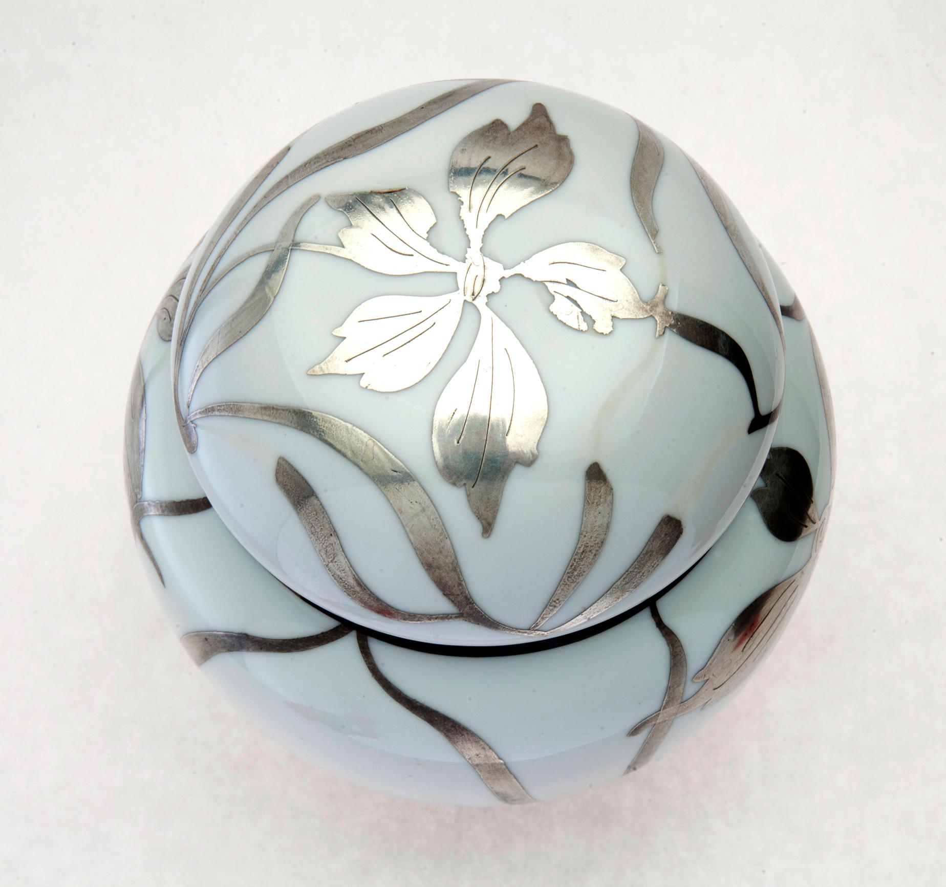 Art Nouveau ginger jar in fine porcelain with sterling silver overlay.