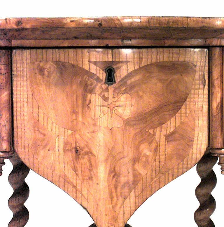 Austrian Biedermeier burl ash and inlaid round table with Gothic design apron and spool supports, circa 1840.
 